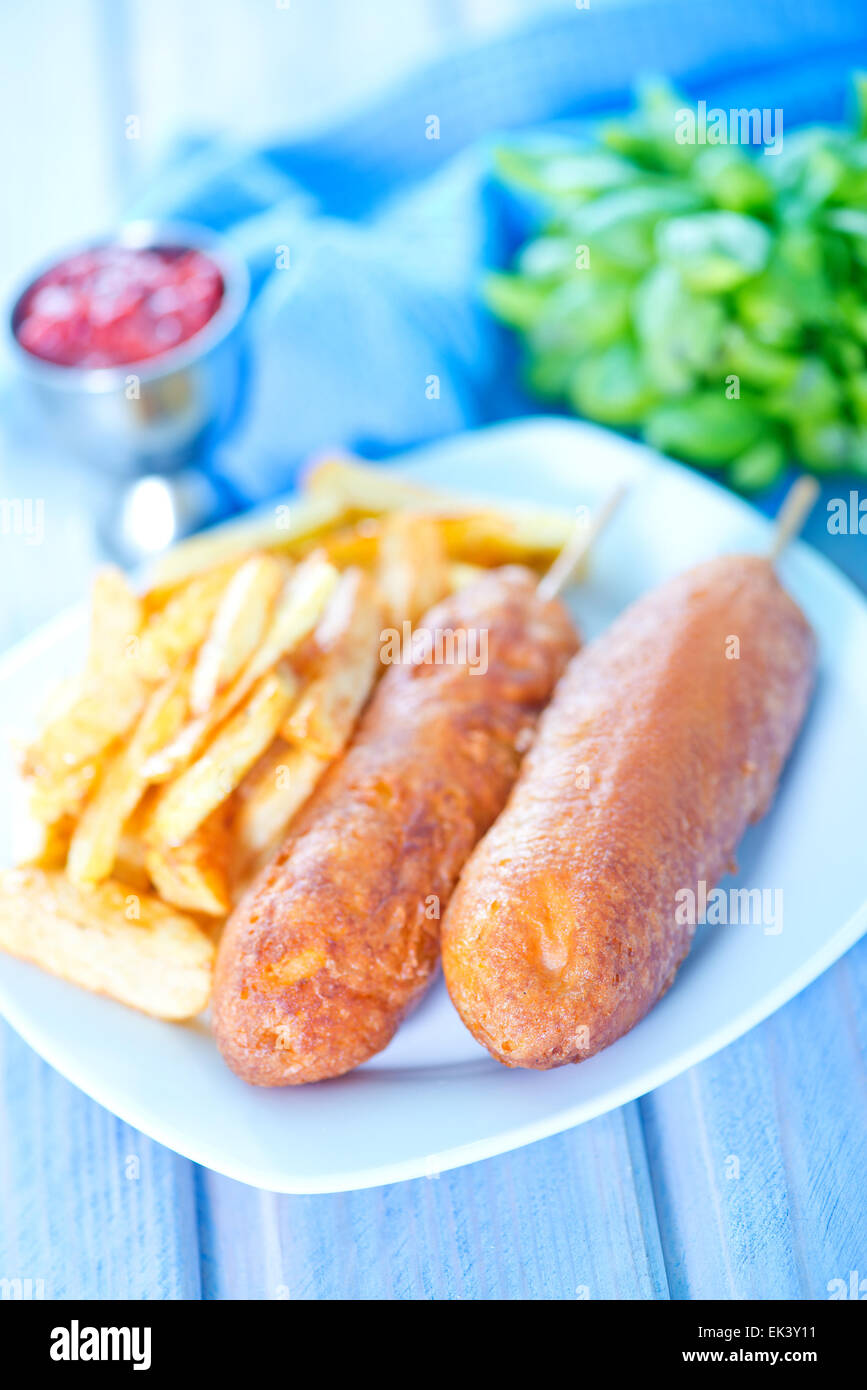 corndogs on the plate and on a table Stock Photo