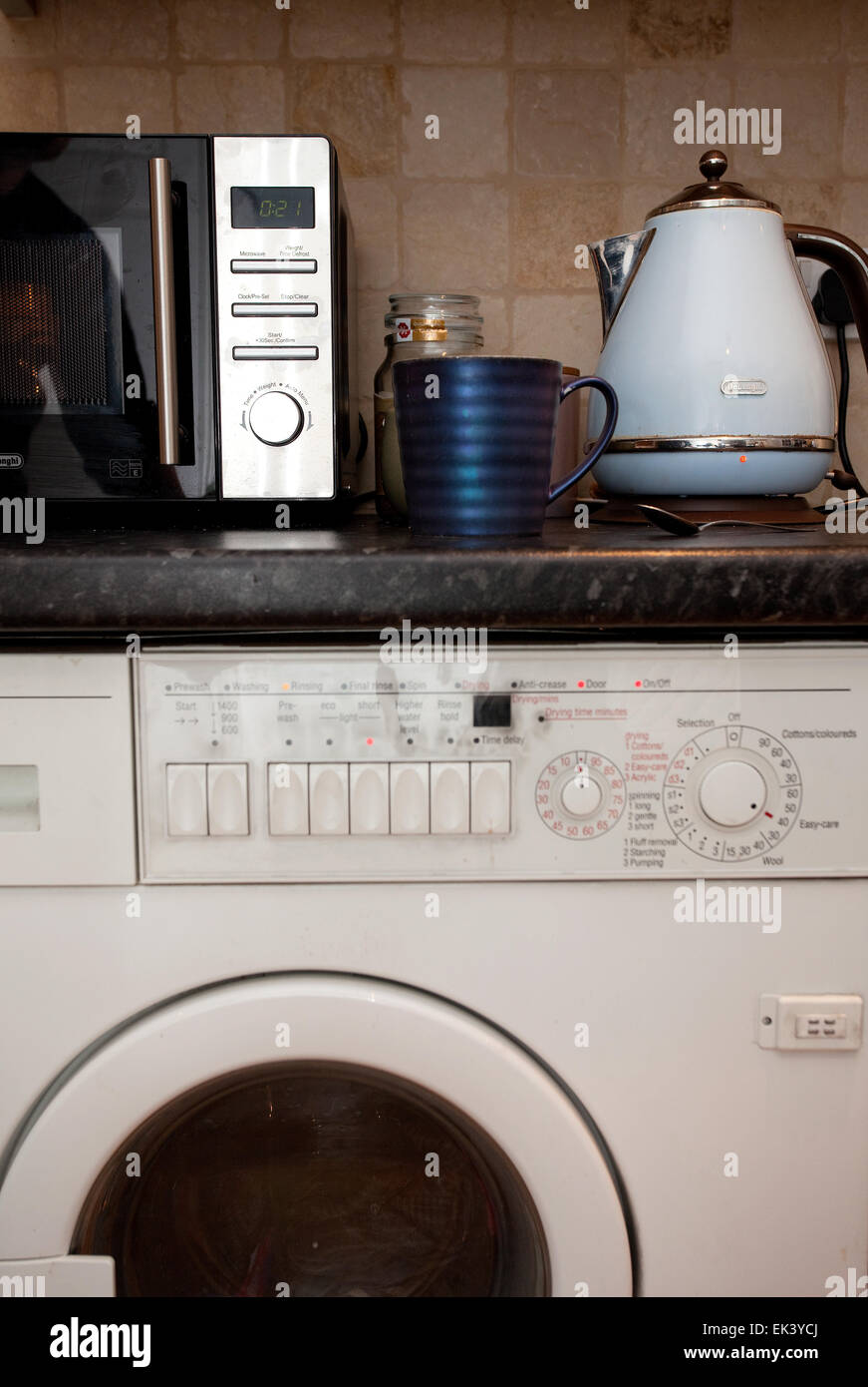 All appliances on kitchen worktop being used at once Stock Photo Alamy