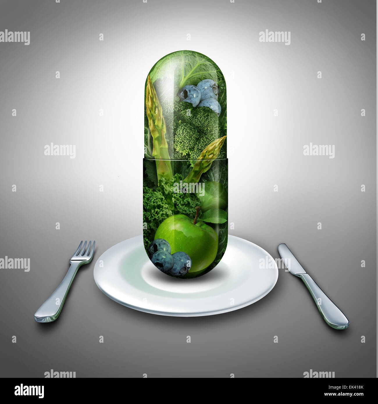 Food supplement concept as a giant pill or medicine capsule with fresh fruit and vegetables inside on a table place setting as a nutrition and dietary symbol for good eating health and fitness lifestyle. Stock Photo