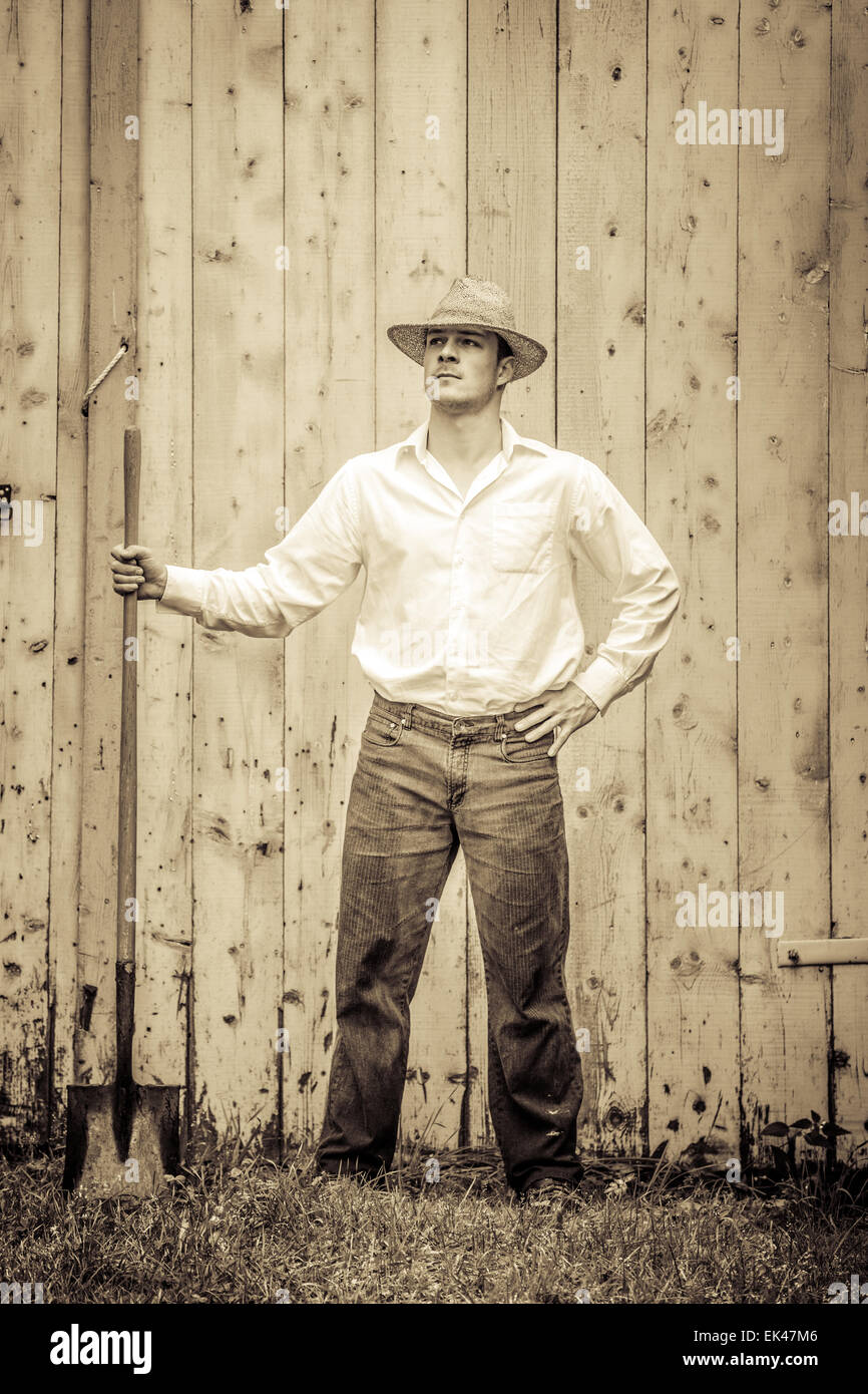 Young Proud Farmer standing up in front of Barn Stock Photo - Alamy