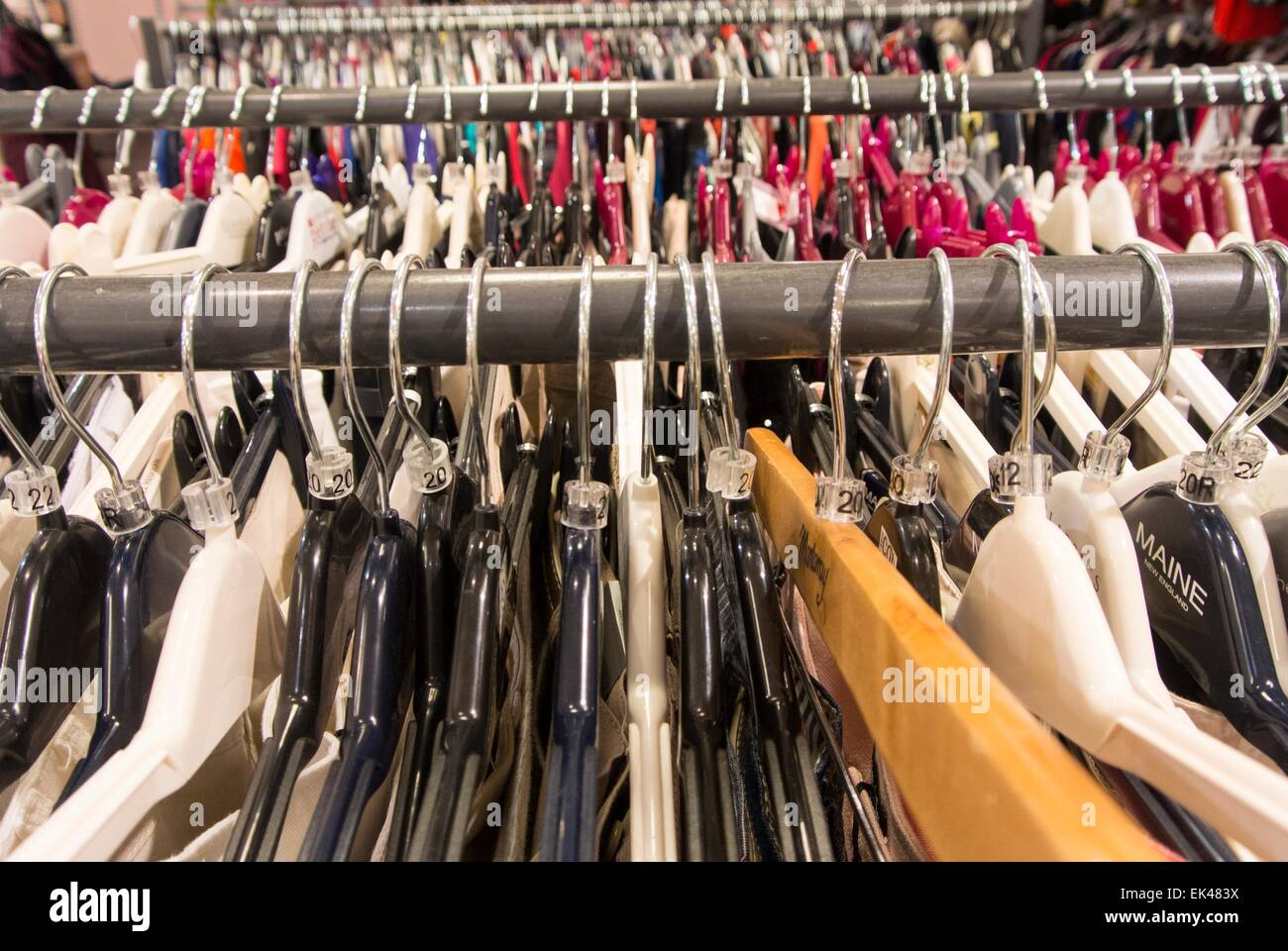 Clothes and coat hangers department store Stock Photo