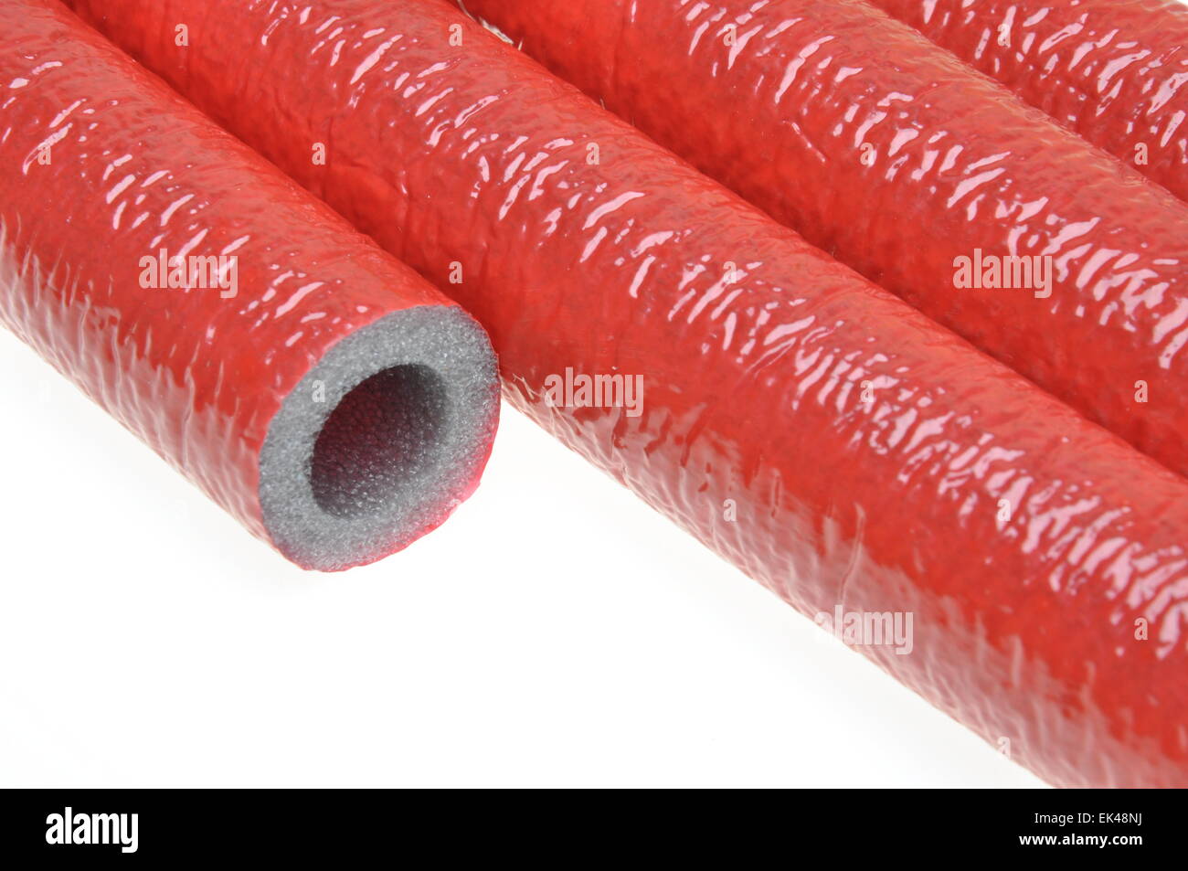 Pipe insulation on hot water pipes on white Stock Photo Alamy