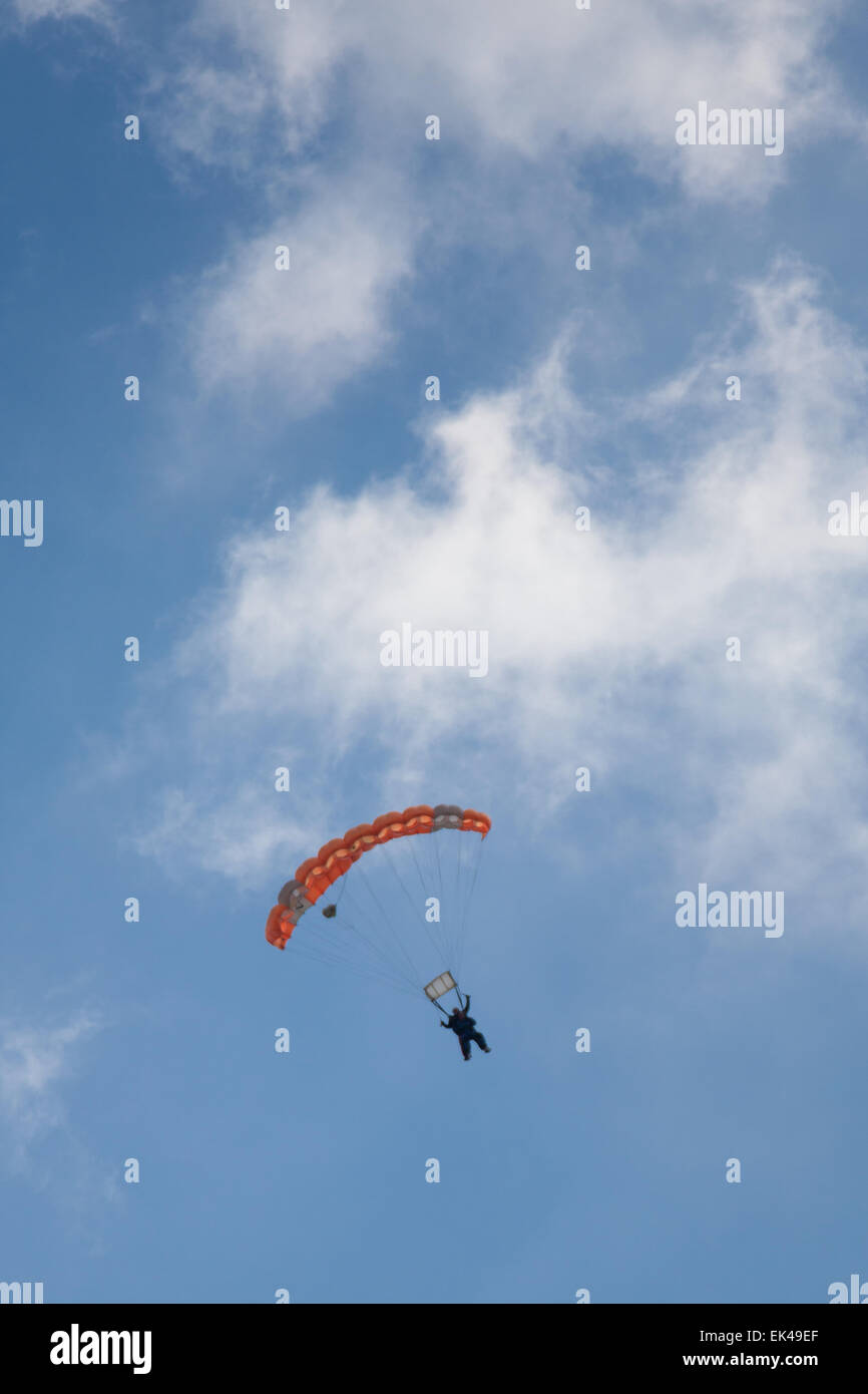 Parachutists coming in to land at Old Sarum airfield following a skydive from 15,000ft above Salisbury Plain Stock Photo