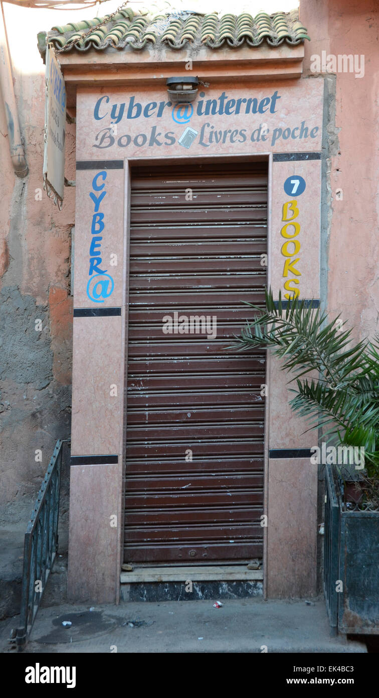 Closed shuttered door for Internet cyber café in Marrakesh souk bazaar Morocco Stock Photo