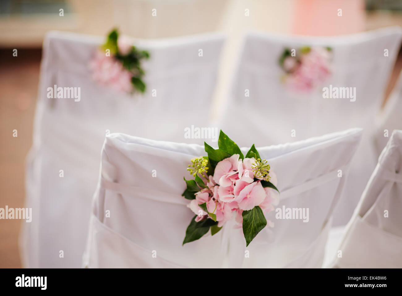 wedding chair covers with pink flowers Stock Photo