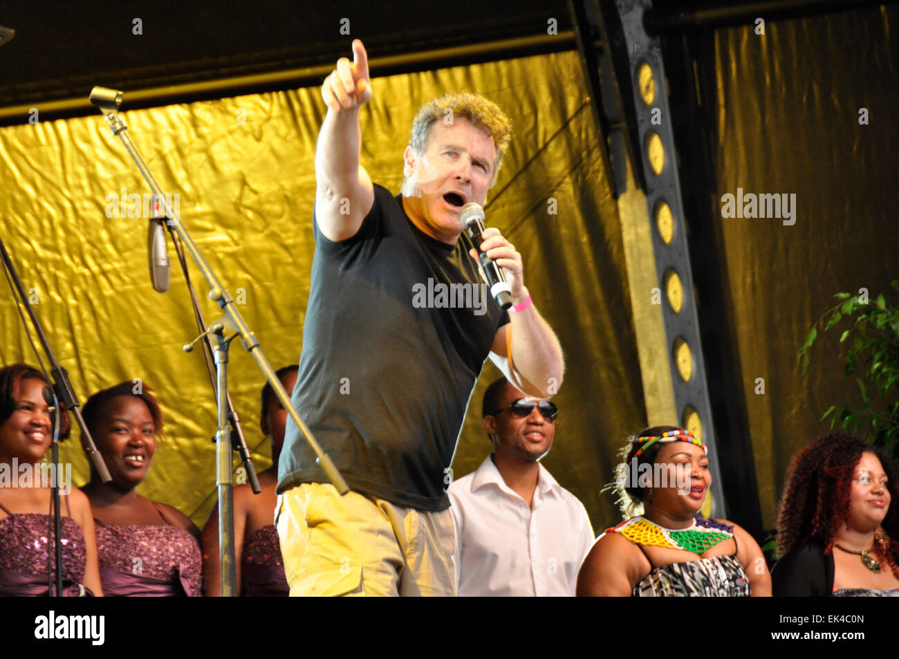 South African musician Johnny Clegg, sang “Asimbonanga” at memorial concert for Mandela in Cape Town. Cape Town. Crowds danced and sang to Johnny Clegg, Freshly Ground, Annie Lennox, Bala brothers and more. Speakers included minister Trevor Manual and Premier of the Western cape Helen Zille.The feeling was one of joy and unityat the Cape Town Stadium for the rainbow nation as all races, ages and gender attended the tribute for Mandela. Stock Photo