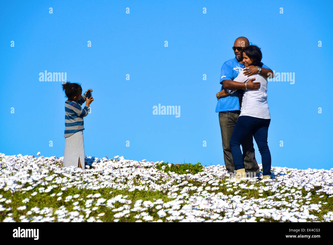 A child takes a picture of their loving parents. Stock Photo