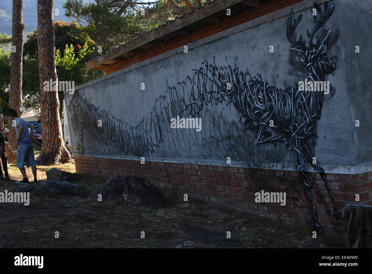 Urban art by Chinese-born artist, DALeast in Rocklands park, Cape Town.DAL or DALEast as he is known lives in Cape Town but has  DAL's street mural titled 'Deer Park' on the streets of Cape Town using his now famous ribbon 3D style. Stock Photo