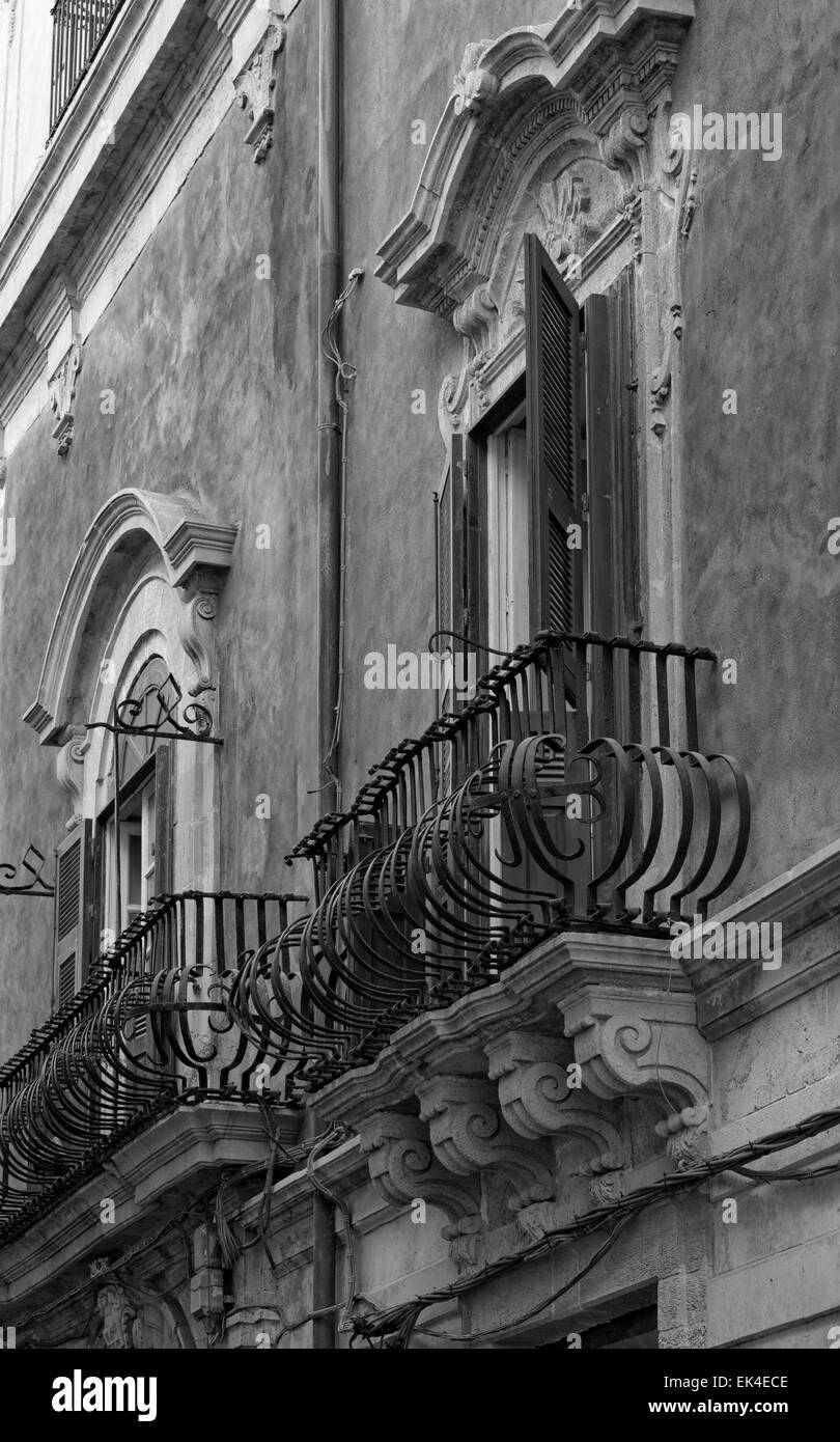 Italy, Sicily, Siracusa, Ortigia, original balcony in a baroque building facade Stock Photo