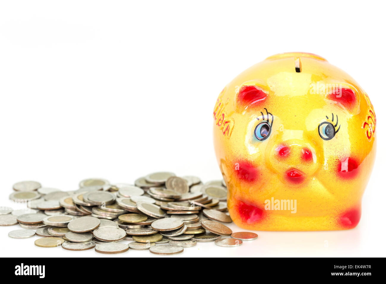 Yellow ceramic piggy bank and coin isolated on white background Stock ...