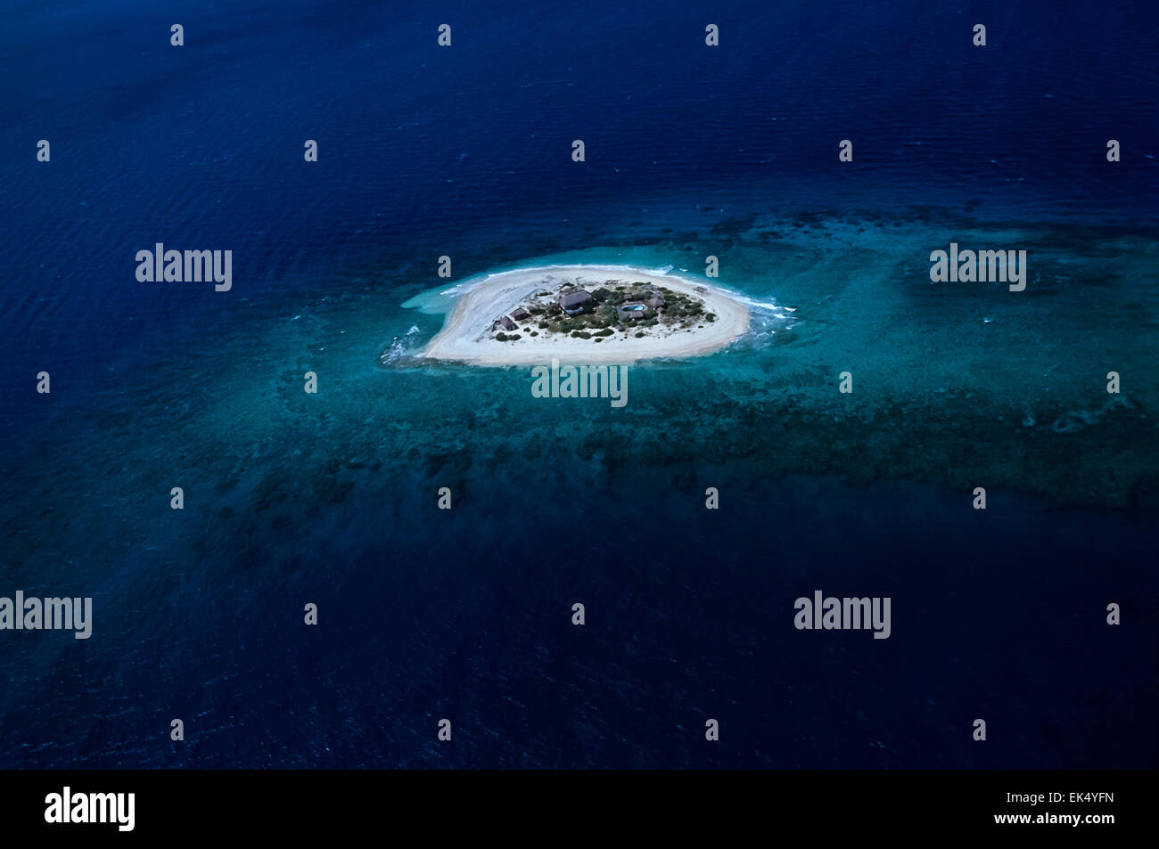 Maldive Islands, aerial view of a resort on a small island surrounded ...