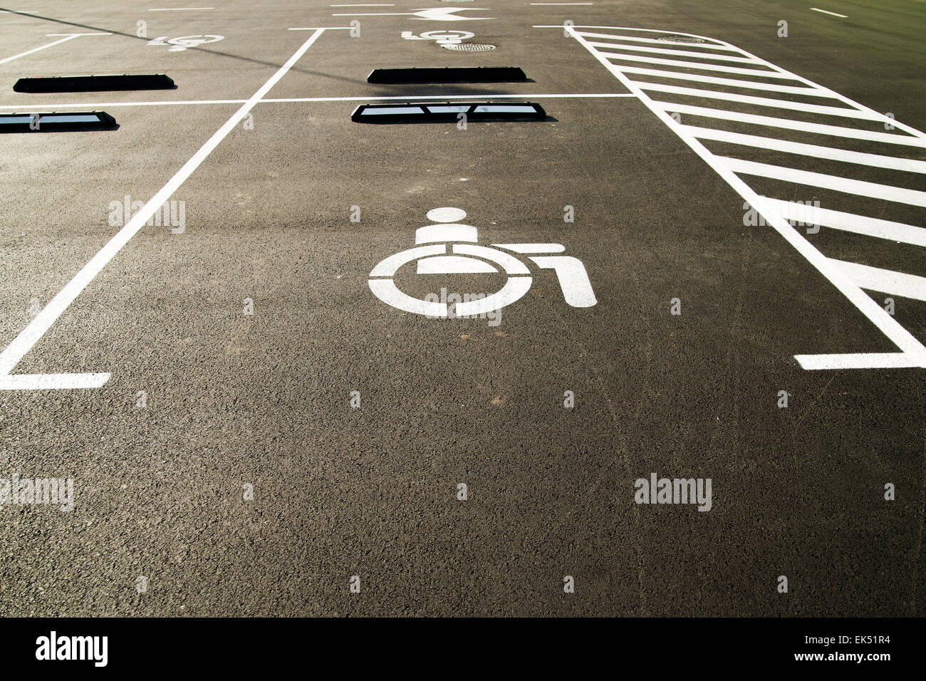 Markings on asphalt indicating a parking space for people with limited opportunities  in the city Stock Photo
