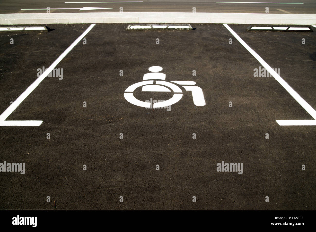 Markings on asphalt indicating a parking space for people with limited opportunities  in the city Stock Photo