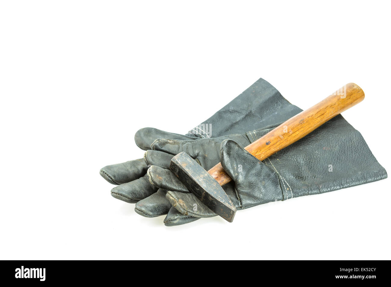 Black safety work glove and hammer isolated on white background Stock Photo