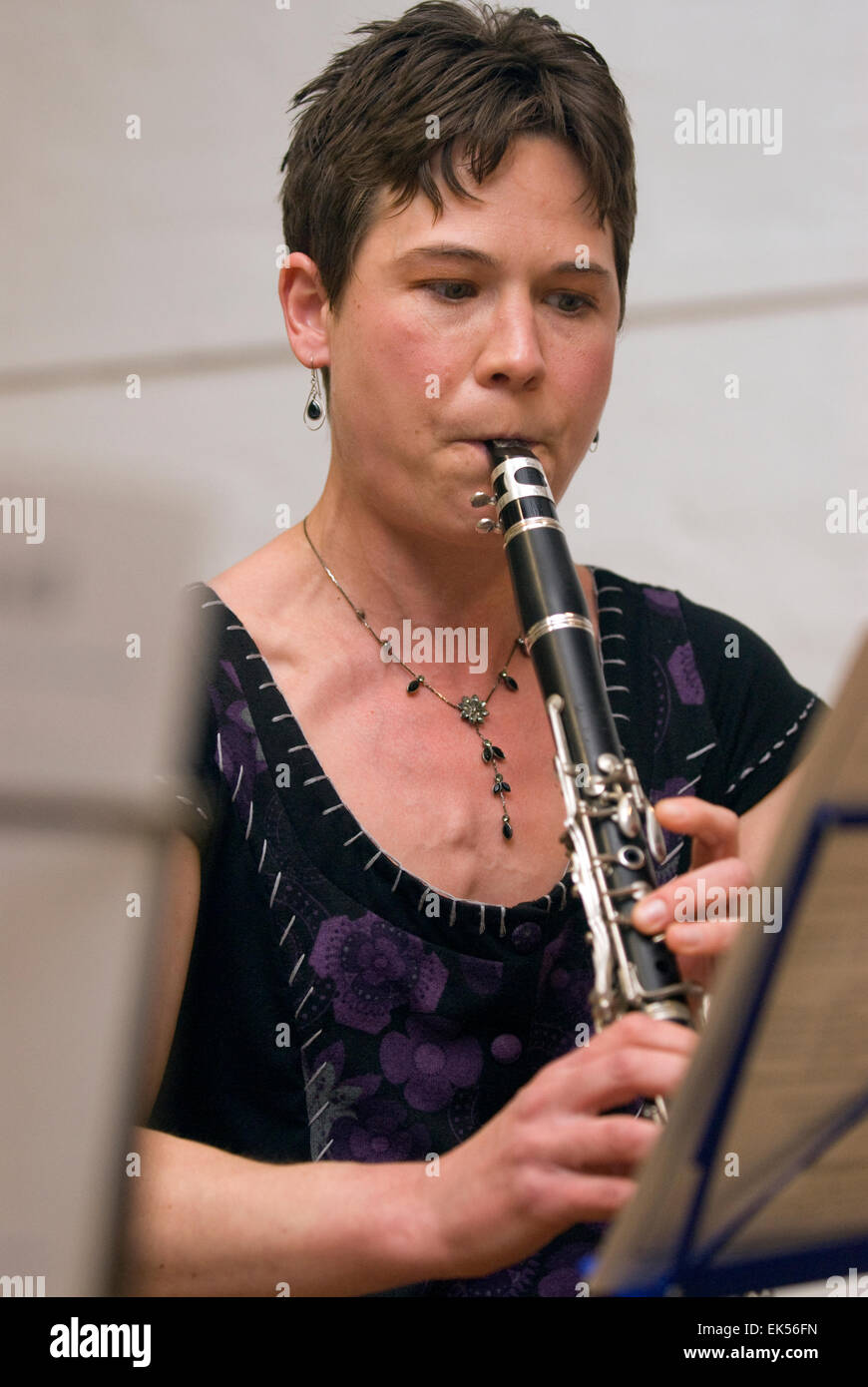 Woman playing the in A at a charitable music concert to