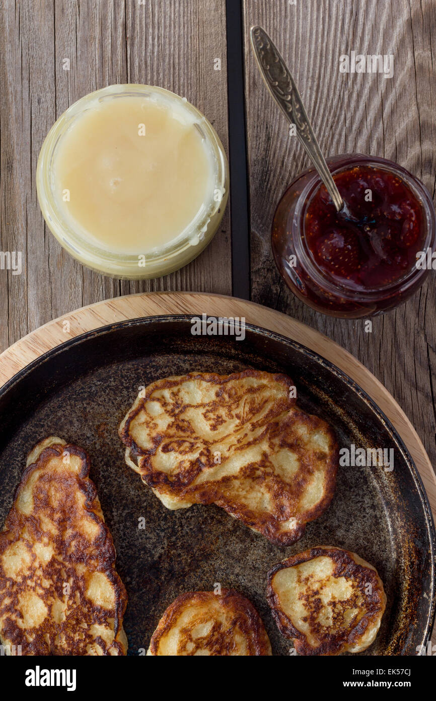 Shot of pan with pancakes, jam, honey top view Stock Photo