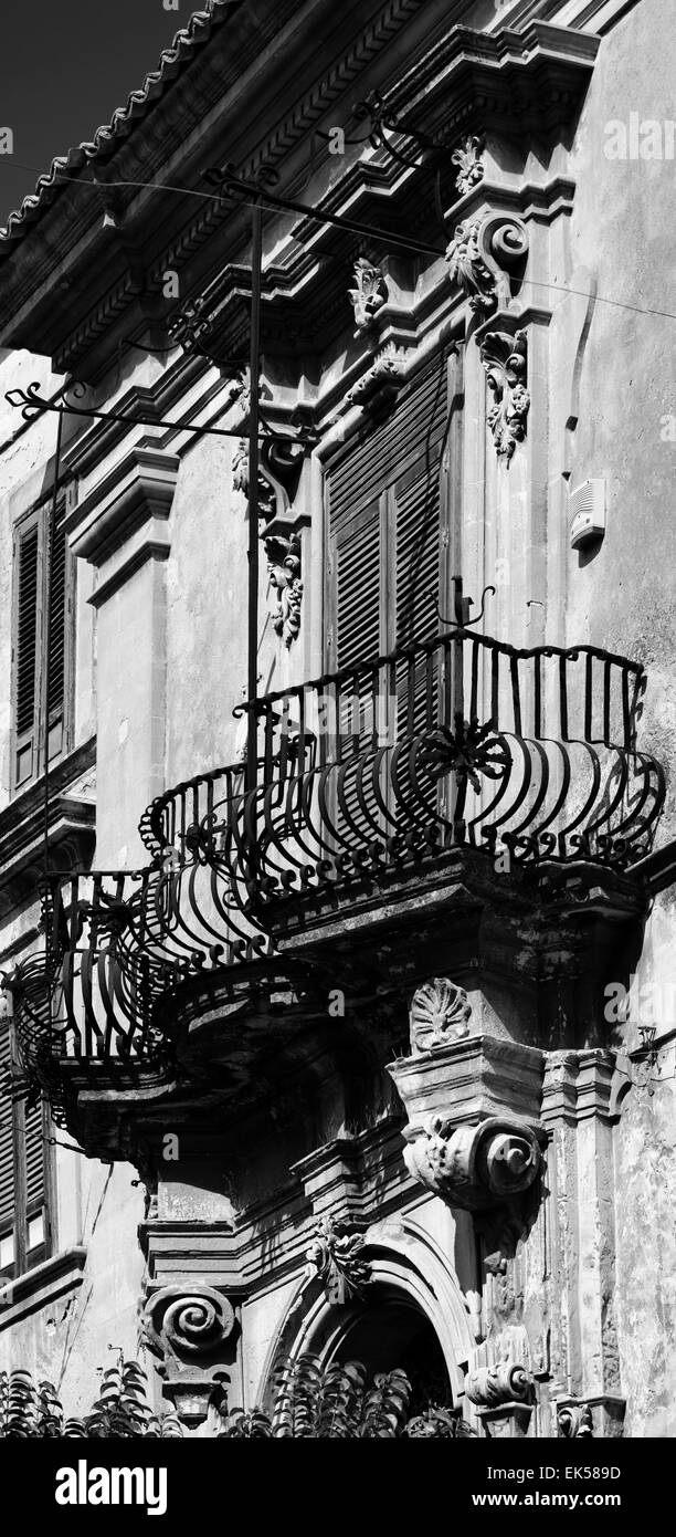 Italy, Sicily, Ragusa, baroque building facade, original balcony Stock Photo