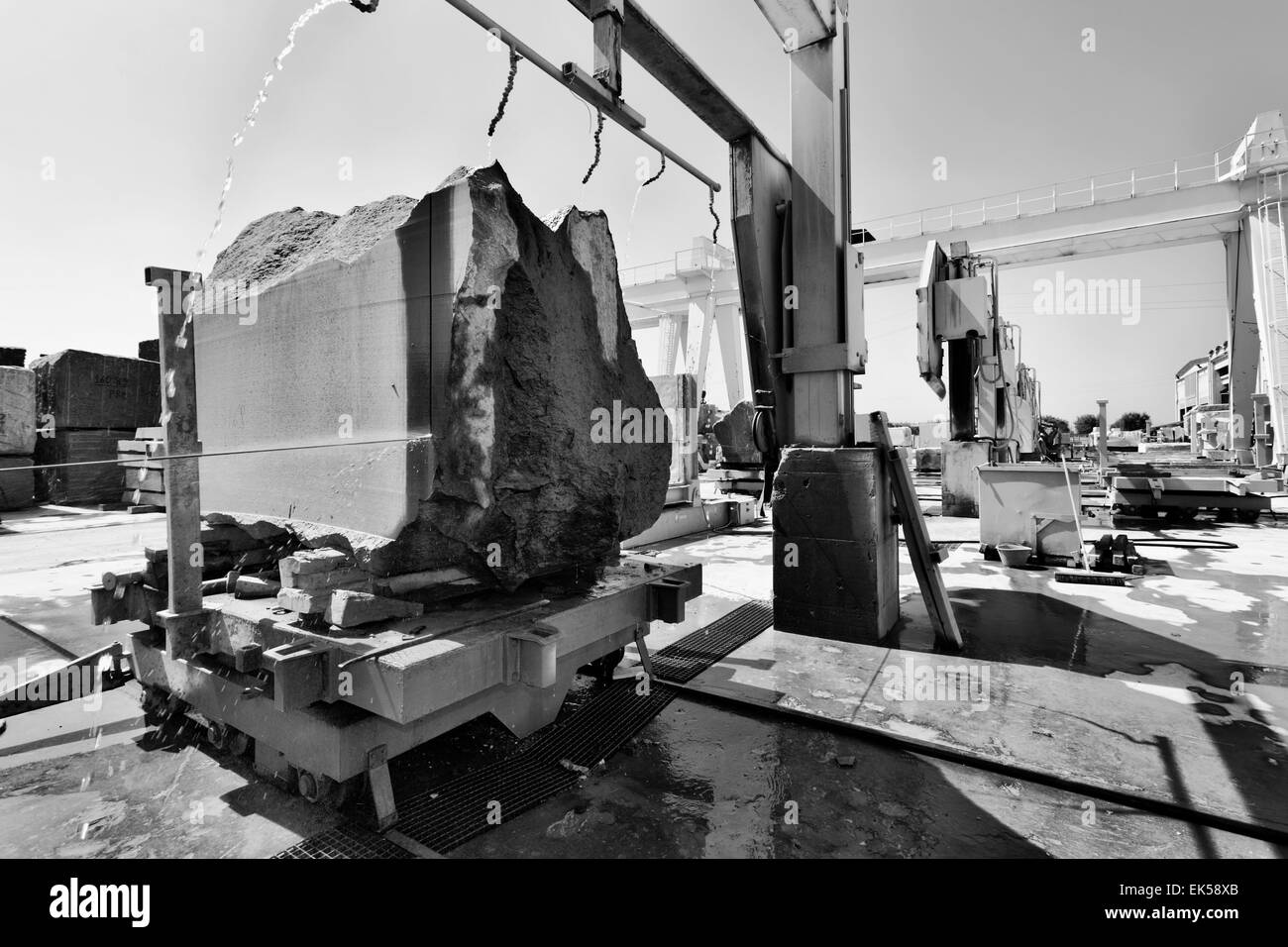 Italy, marble cutting factory, granite block cooled with water while