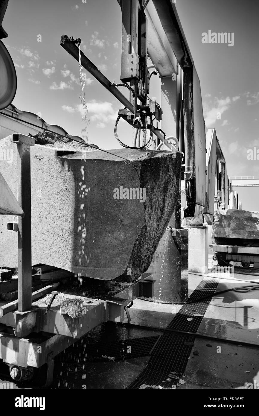 Italy, marble cutting factory, granite block cooled with water while