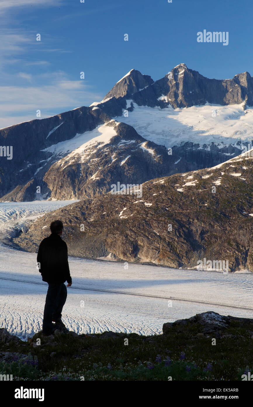 A hiker on Mount Stroller White above the Mendenhall Glacier, Tongass National Forest, Alaska. (model released) Stock Photo