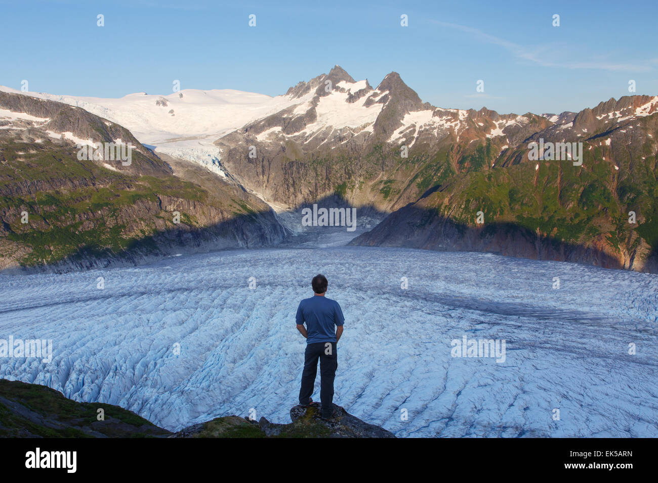 A hiker on Mount Stroller White above the Mendenhall Glacier, Tongass National Forest, Alaska. (model released) Stock Photo