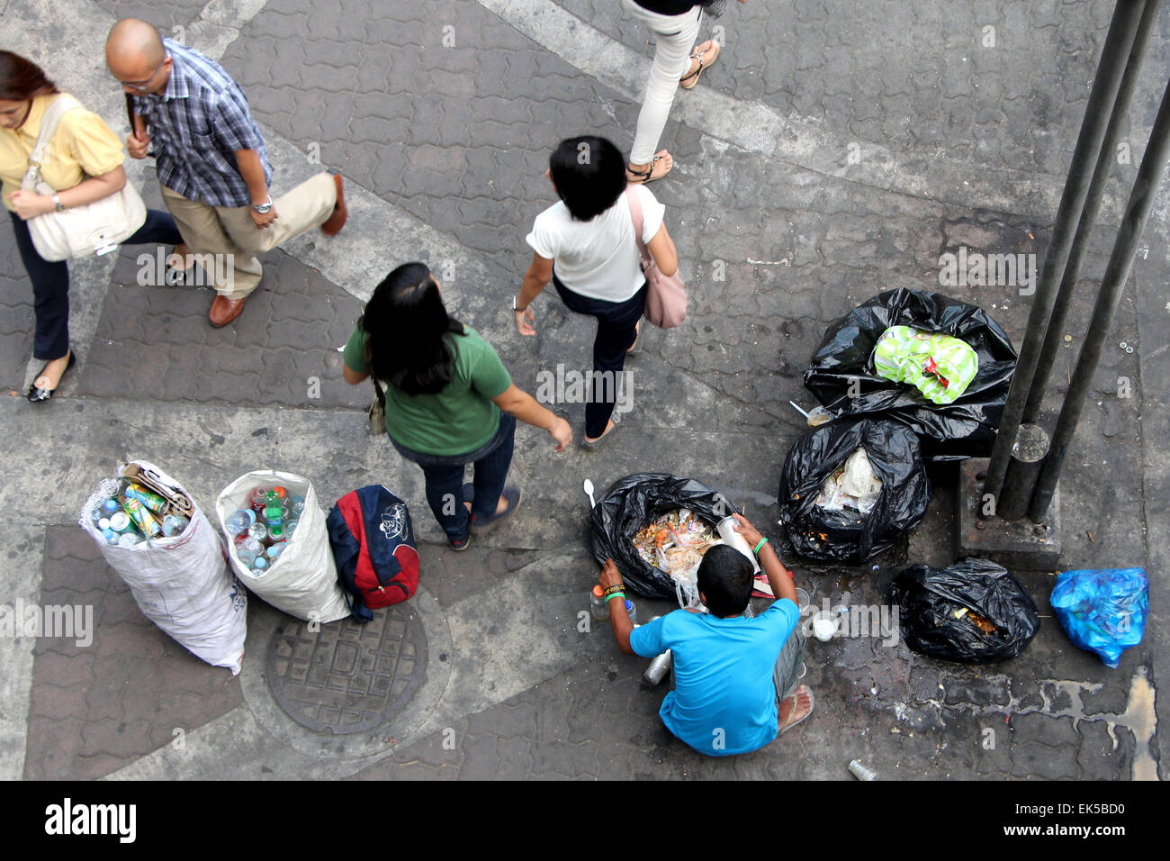 scavengers collecting a plastic bottles 