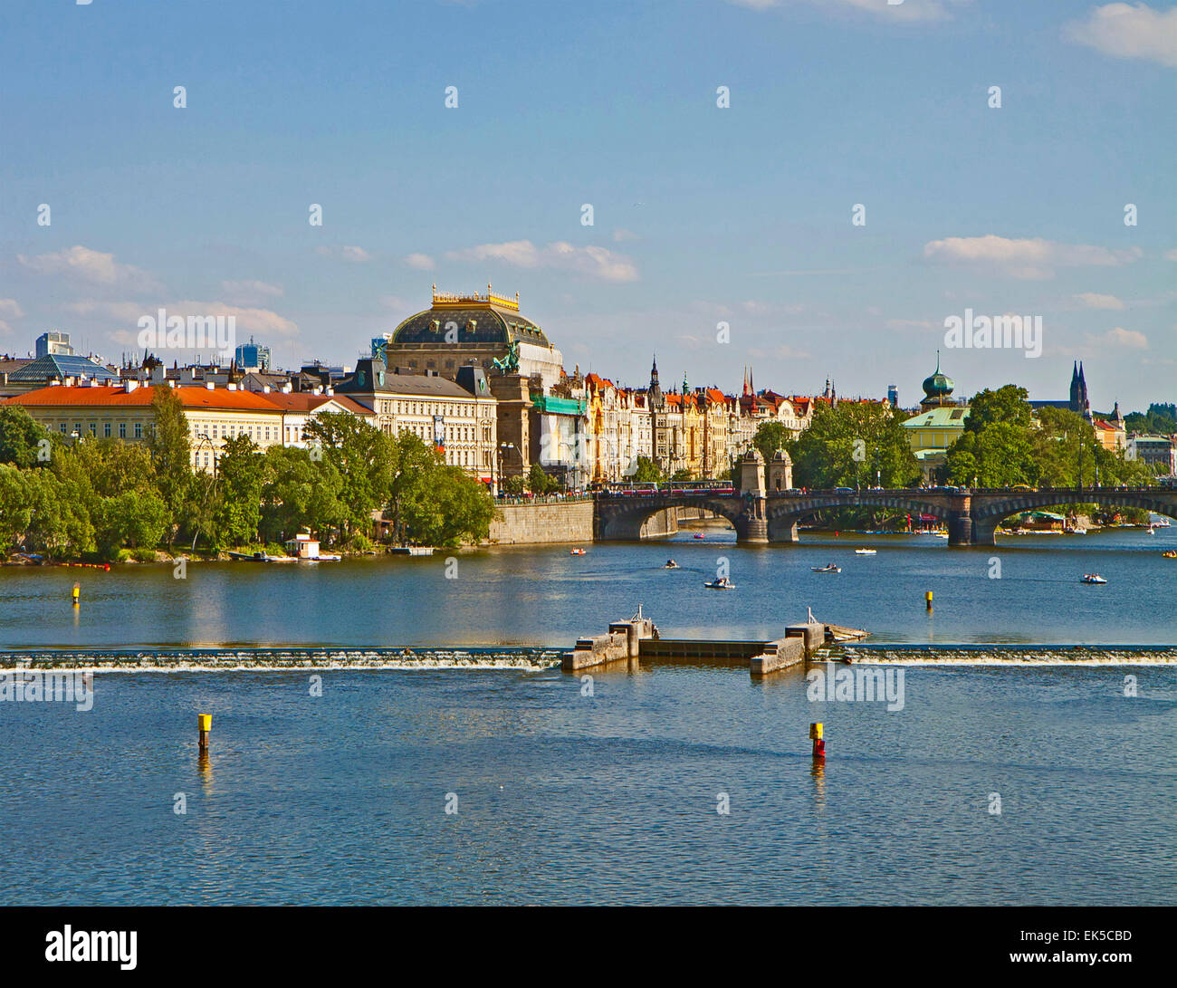 River Moldau at Prague: many small boats  cruise its water and  offer to the tourists  a beautiful view of the city Stock Photo