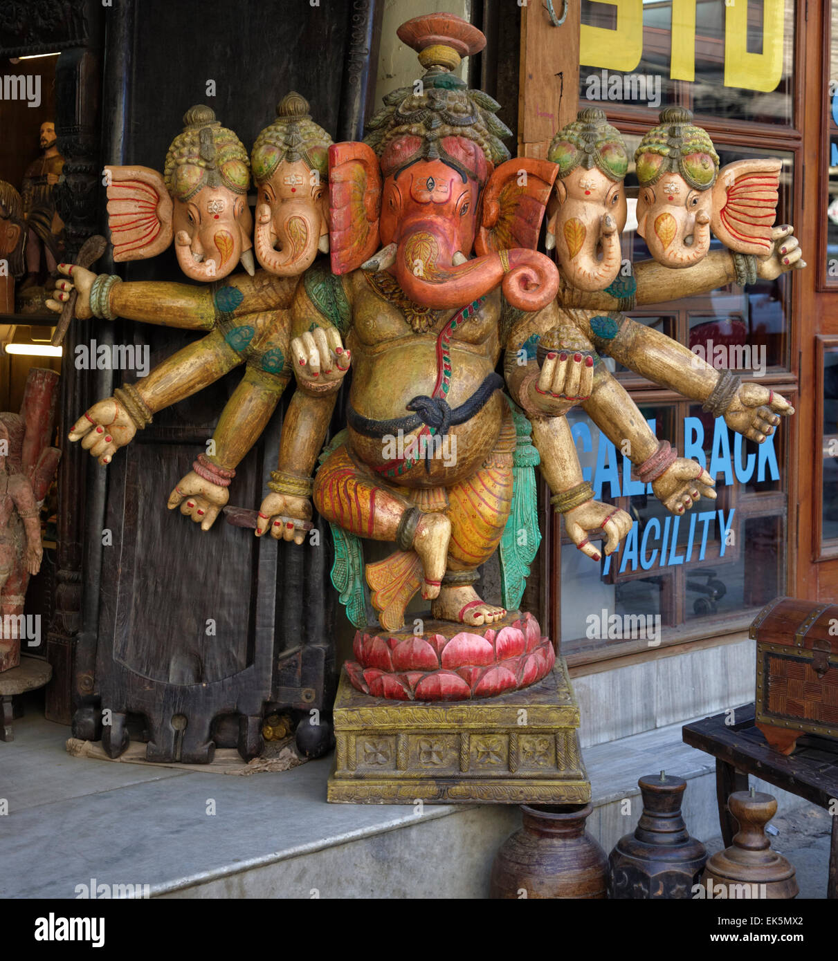 India, Delhi, wooden hindu Ganesh God statue for sale in a local store