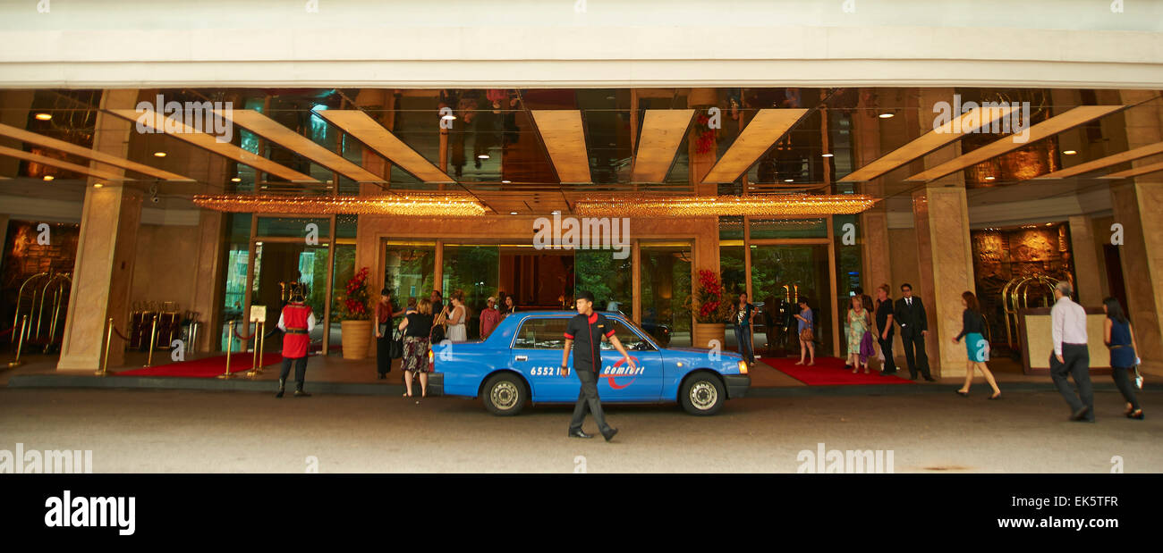 Taxi waits at the entrance to a 5 star hotel Stock Photo
