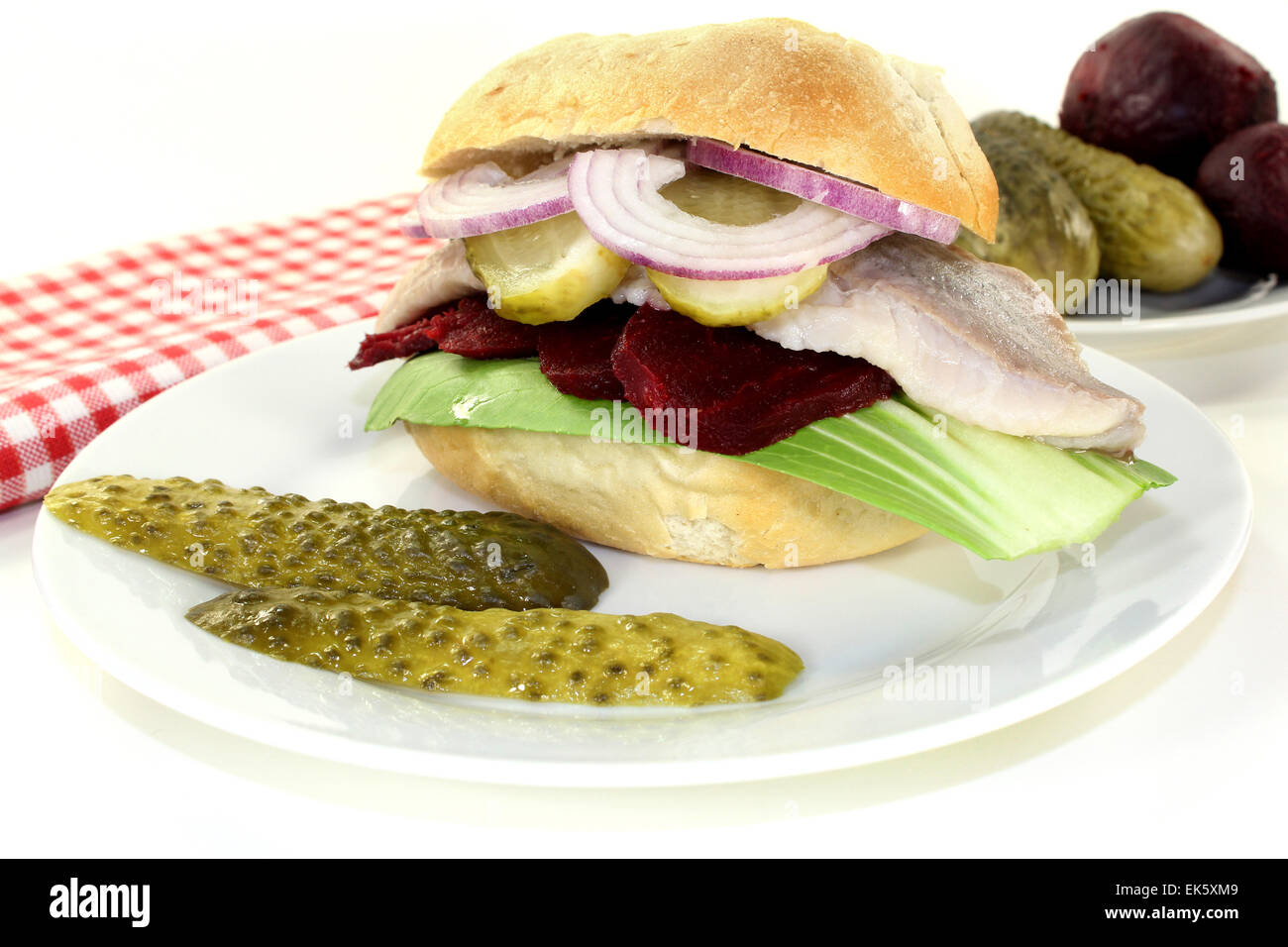 Pickled herring sandwiches with onion, beetroot and pickled cucumber Stock Photo