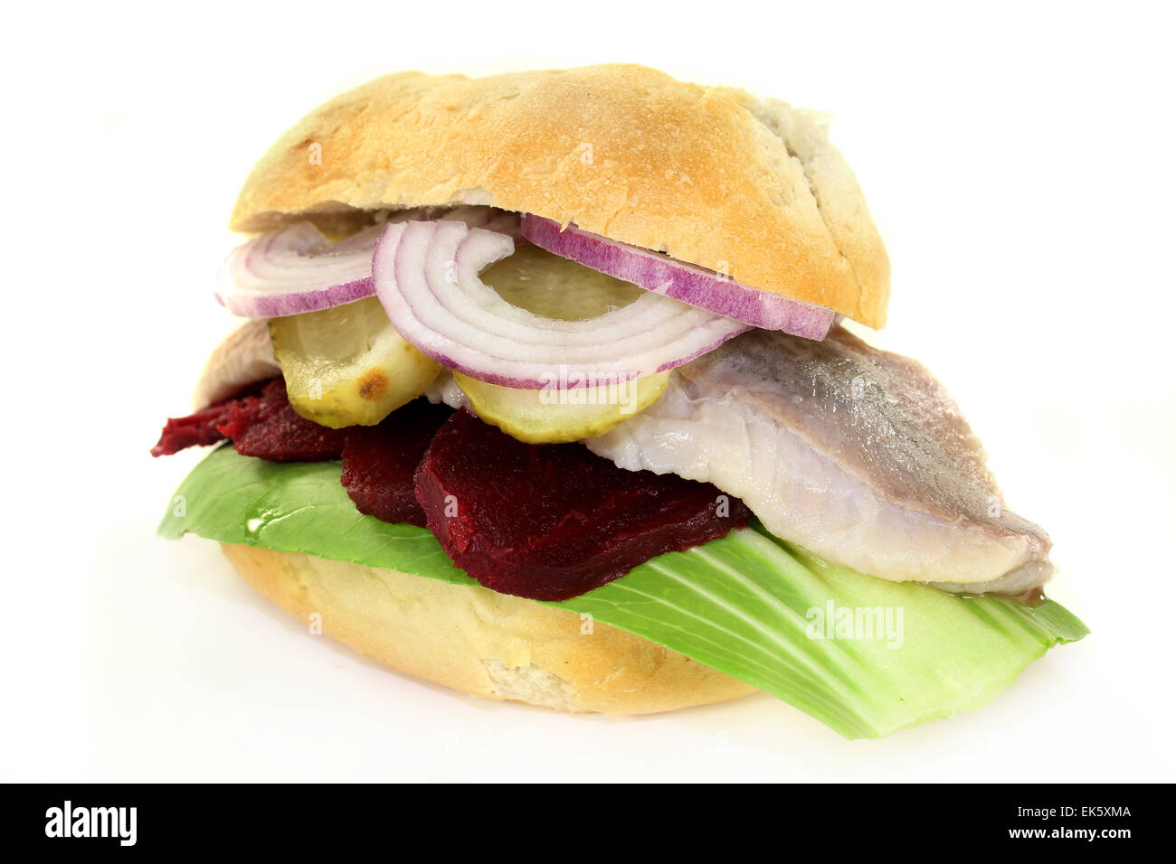 Pickled herring sandwiches with onion, beetroot and pickled cucumber