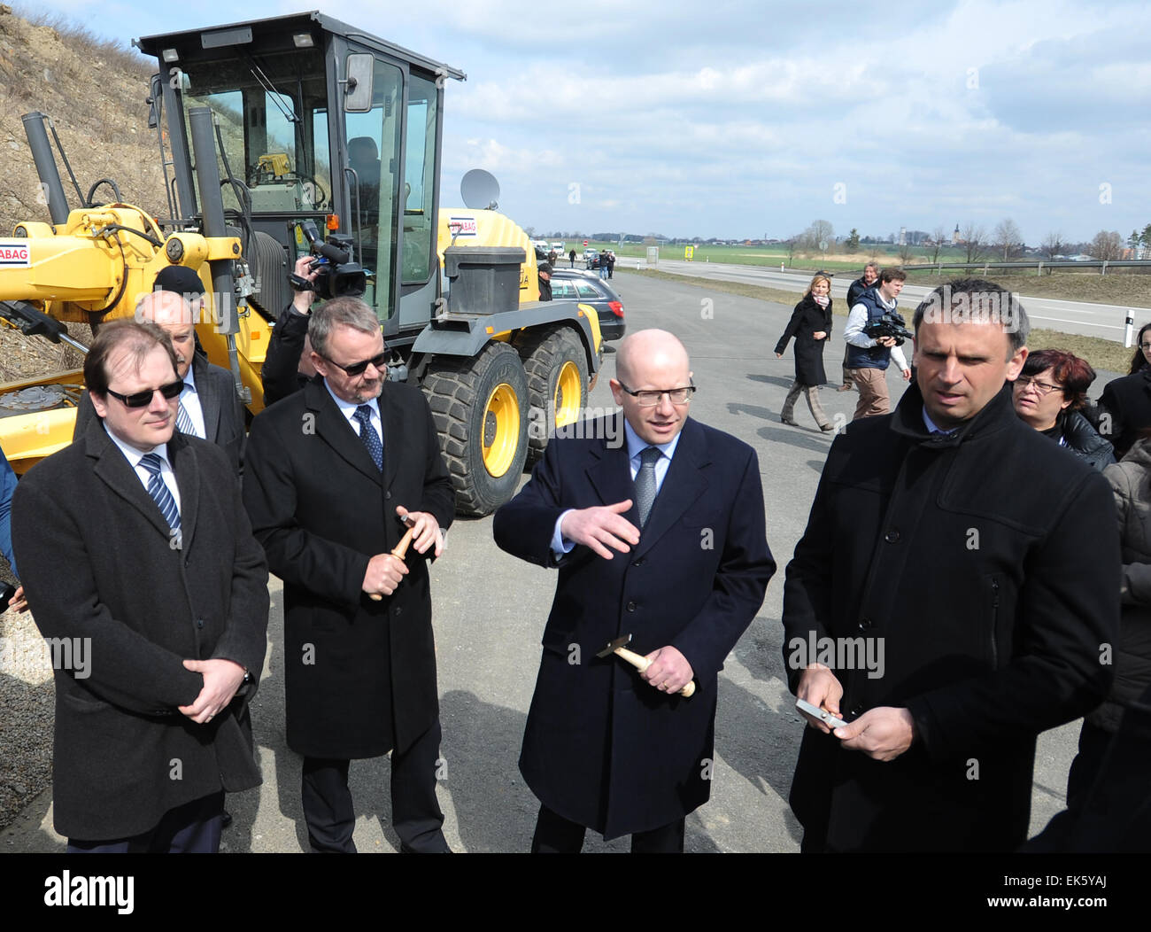 From left to right General Director of Road and Motorway Directorate of the Czech Republic Jaroslav Kroupa, Czech Minister of Transport Dan Tok, Prime Minister Bohuslav Sobotka and Mayor of South Bohemia region Jiri Zimola attend the symbolical ceremony of start the construction of further two sections of motorway D3 was held in Veseli nad Luznici, Czech Republic, April 7, 2015. Motorway will connect Prague with Ceske Budejovice in section Veseli nad Luznici to Bosilec and in Borek to Usilne. (CTK Photo/Vaclav Pancer) Stock Photo