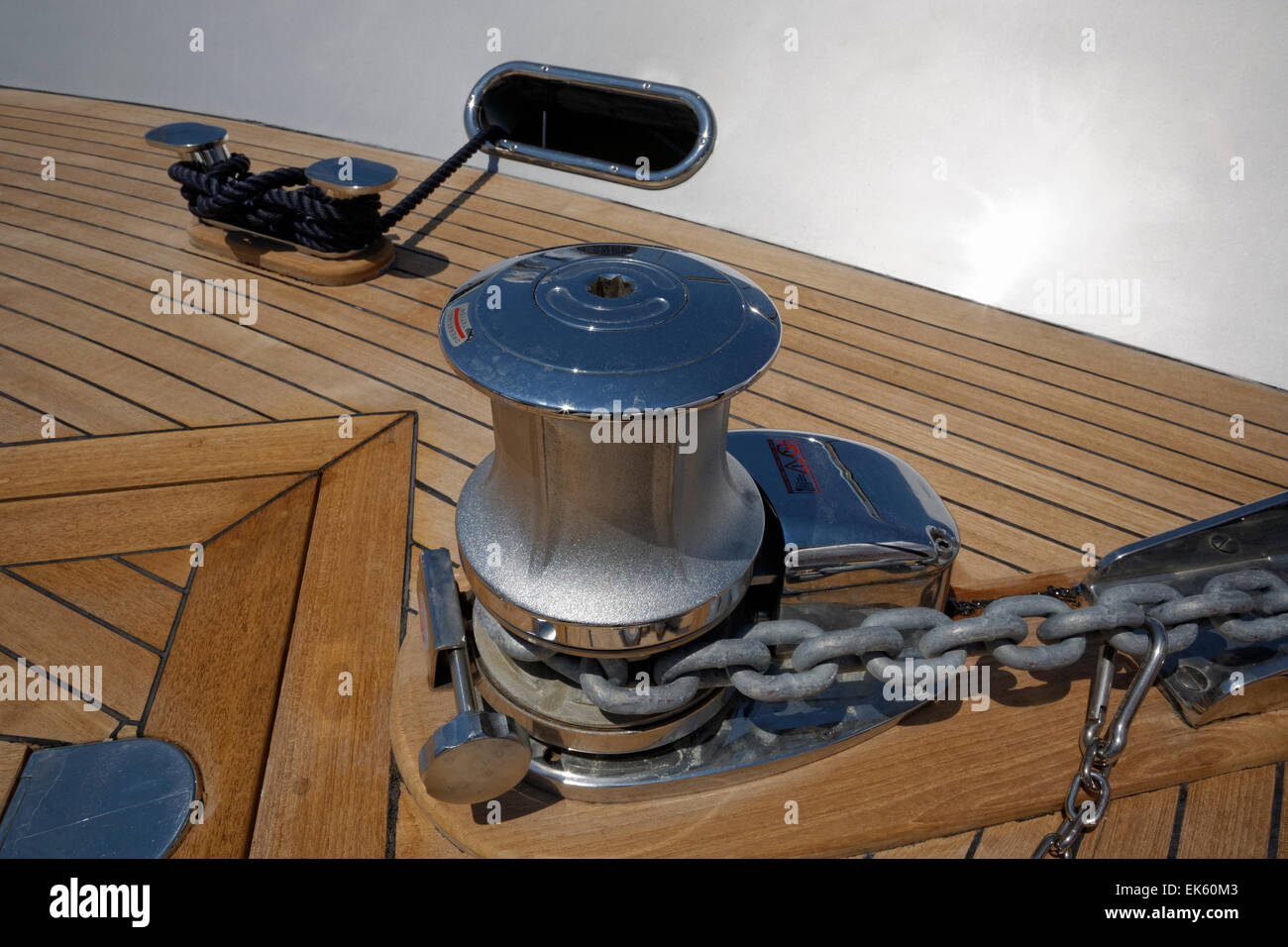 Italy, Viareggio, luxury yacht, rope on steel bow bollards and anchor chain winch Stock Photo