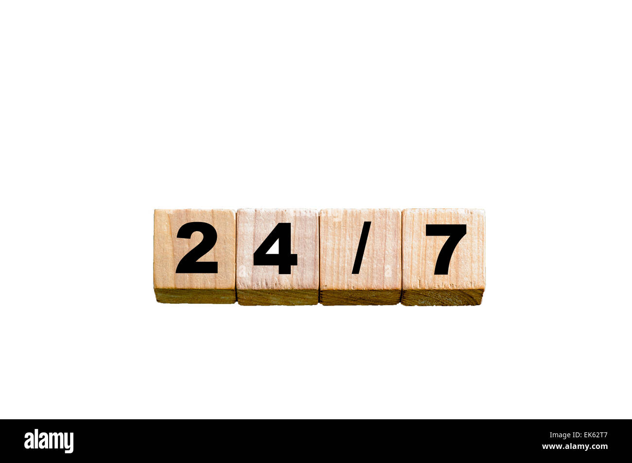 Numbers 24/7. Wooden small cubes with letters isolated on white background with available copy space.Concept image. Stock Photo
