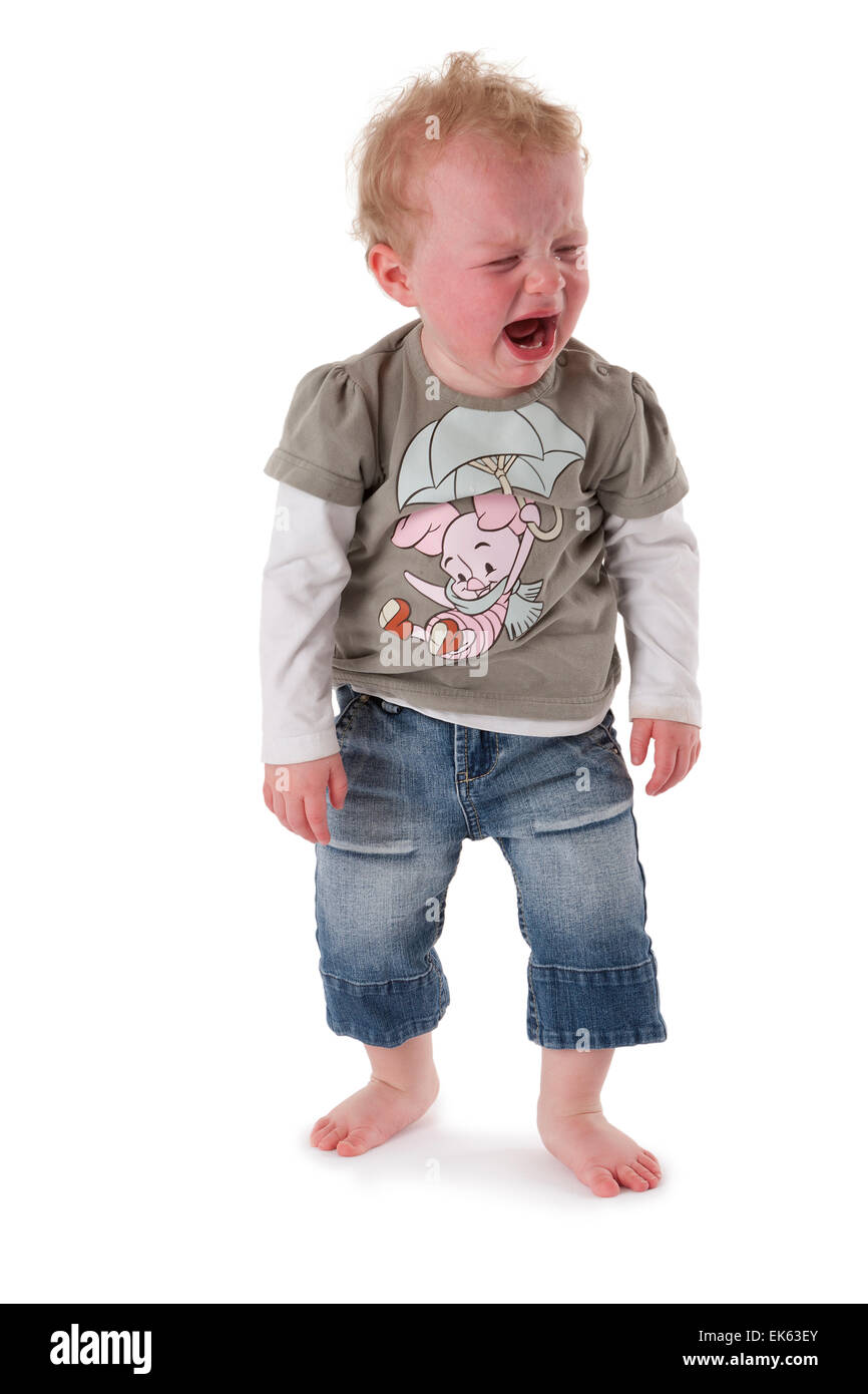 Very angry loud crying little girl on white background Stock Photo