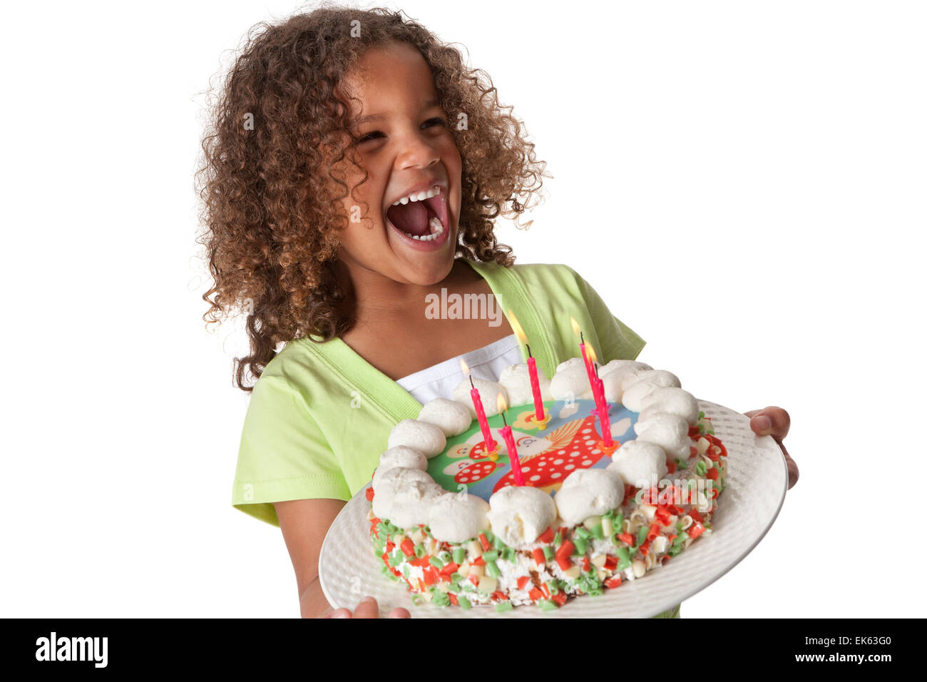 Five year old girl with a birthday cake with 5 candles laughing loud on white background Stock Photo