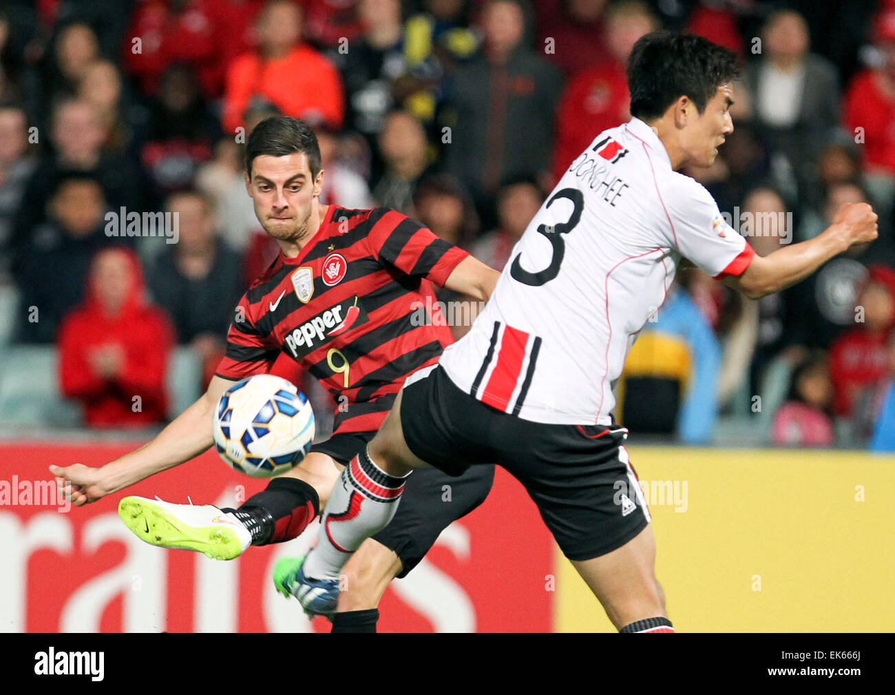 Sydney, Australia. 7th Apr, 2015. Tomi Juric (L) of Western Sydney Wanderers competes during the group H match against FC Seoul at the 2015 AFC Champions League in Sydney, Australia, on April 7, 2015. The match ended with a 1-1 draw. Credit:  Jin Linpeng/Xinhua/Alamy Live News Stock Photo