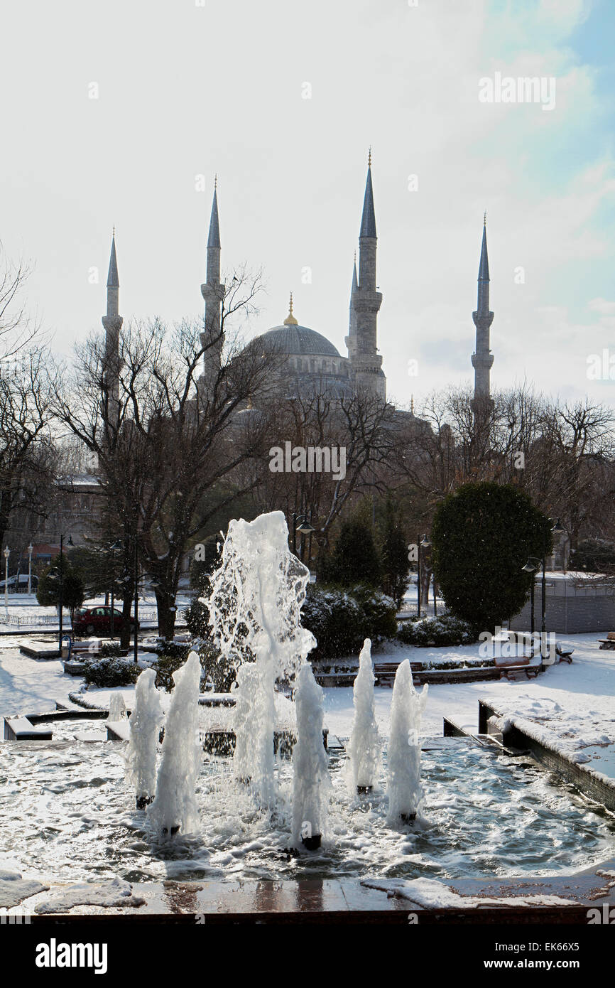 Turkey Snowing Turkey, Istanbul, a fountain and Sultanahmet Imperial Mosque, also ...