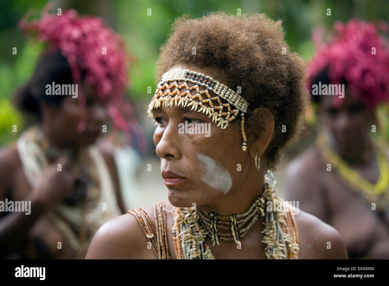 Shells, seeds, beads, feathers and flora are used in colorful ...