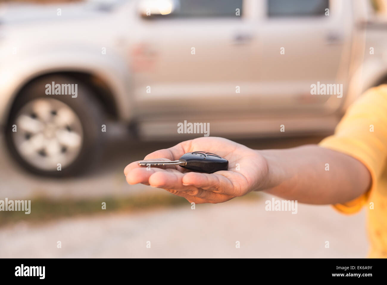Close up Hand holding car key Stock Photo - Alamy