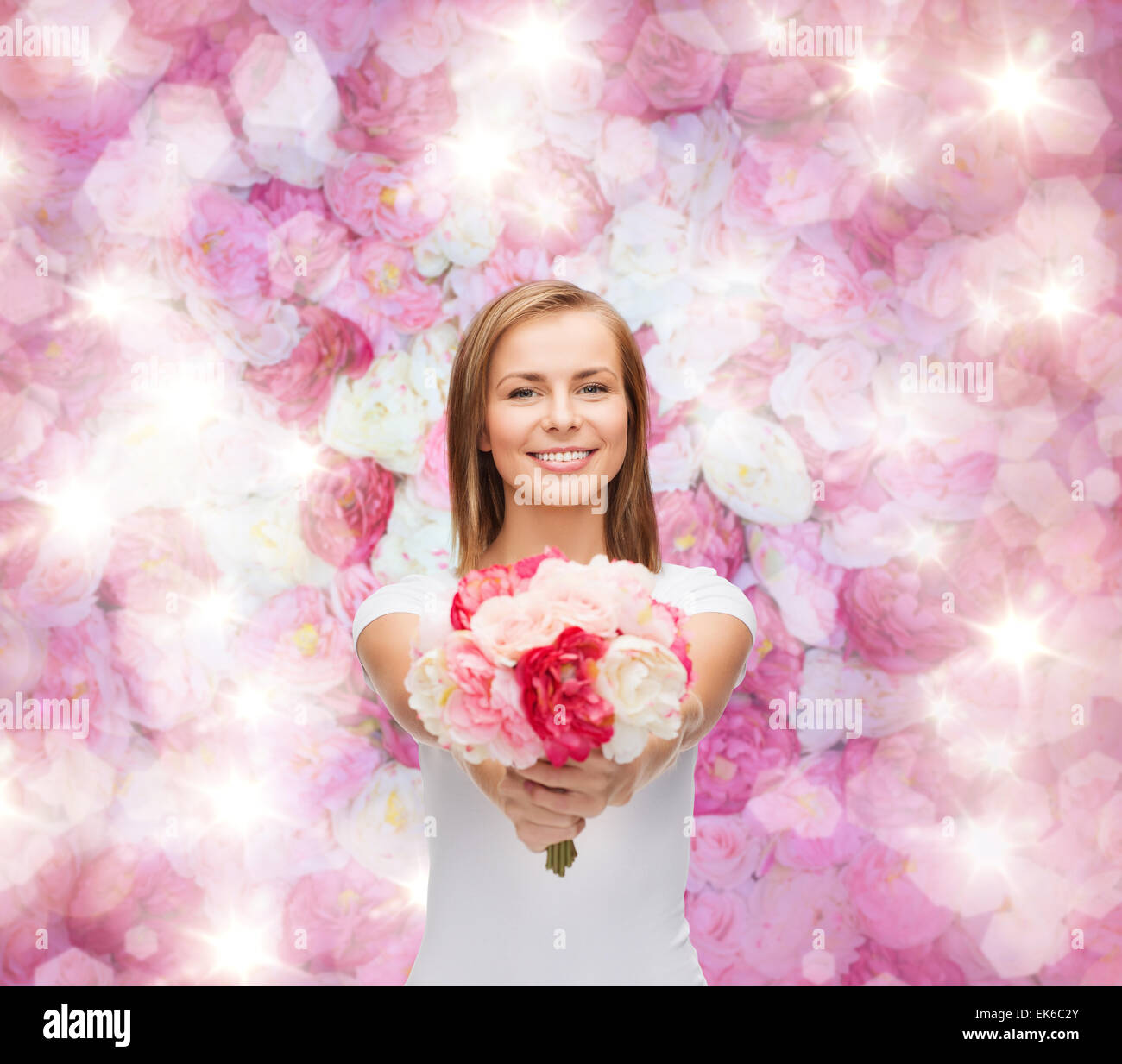 smiling woman with bouquet of flowers Stock Photo - Alamy