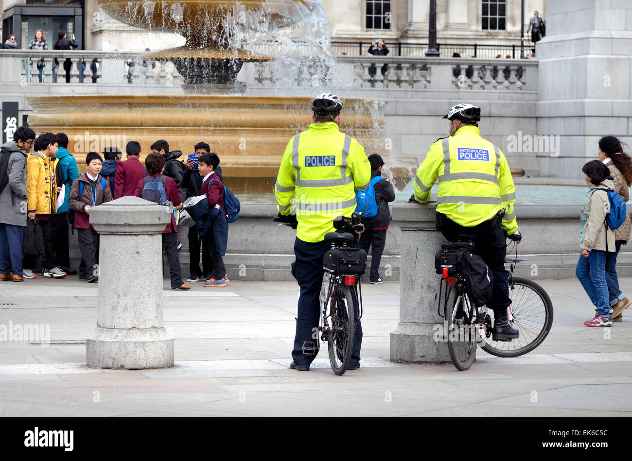 London, England, UK. Metropolitan police officers on bicycles in Trafalgar Square Stock Photo