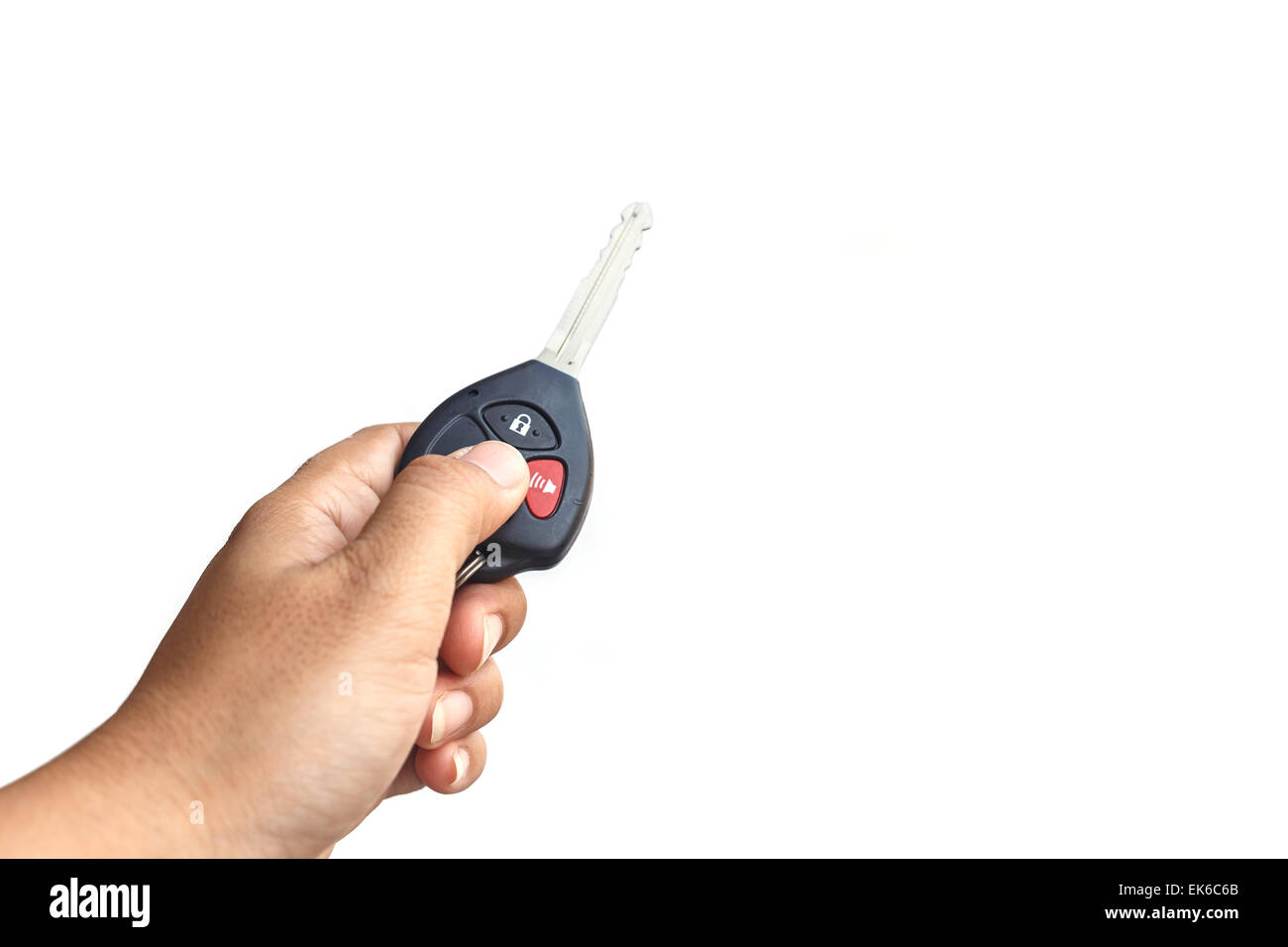 Hand holding car key isolated on white background Stock Photo - Alamy