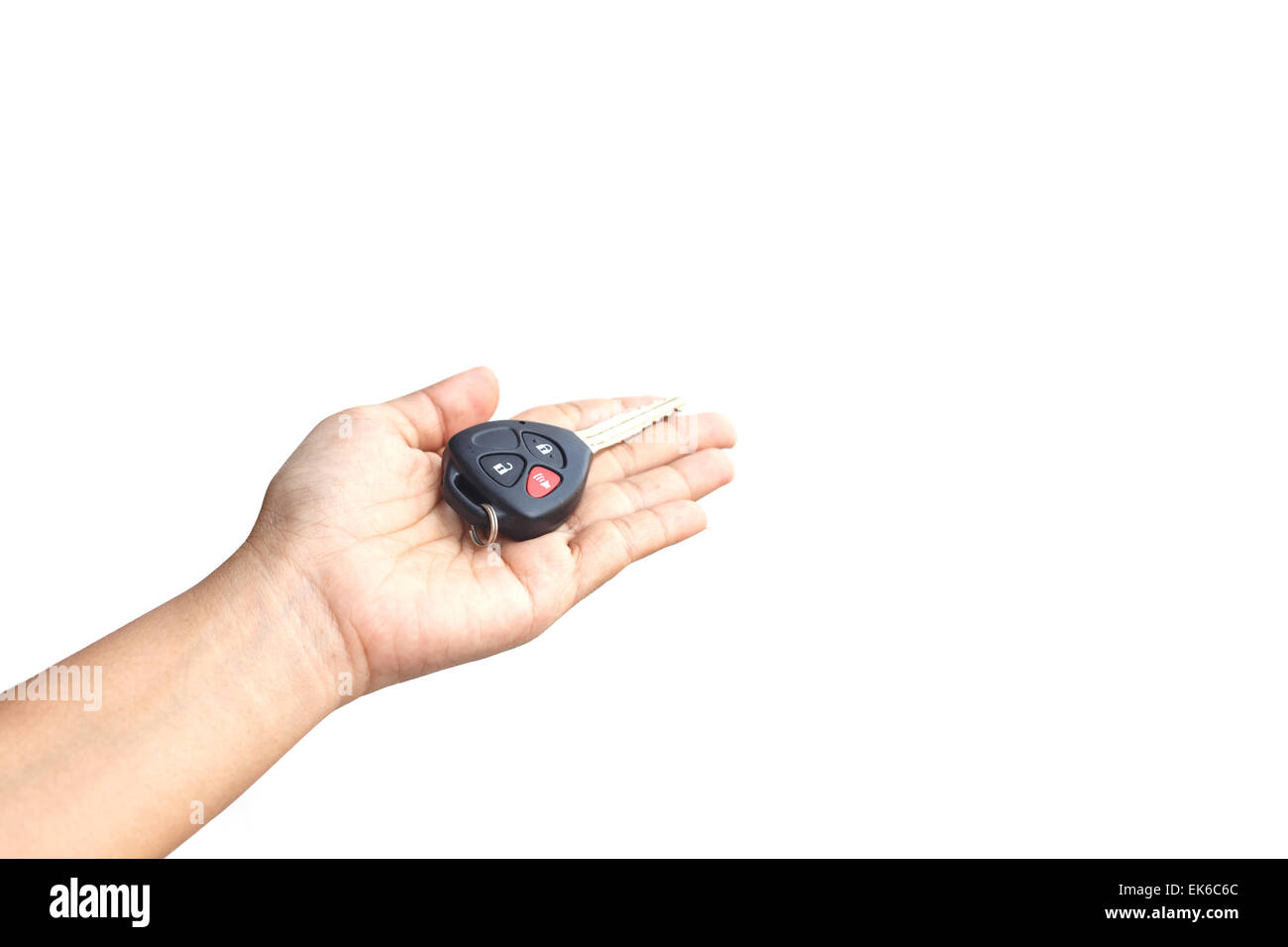 Hand holding car key isolated on white background Stock Photo - Alamy
