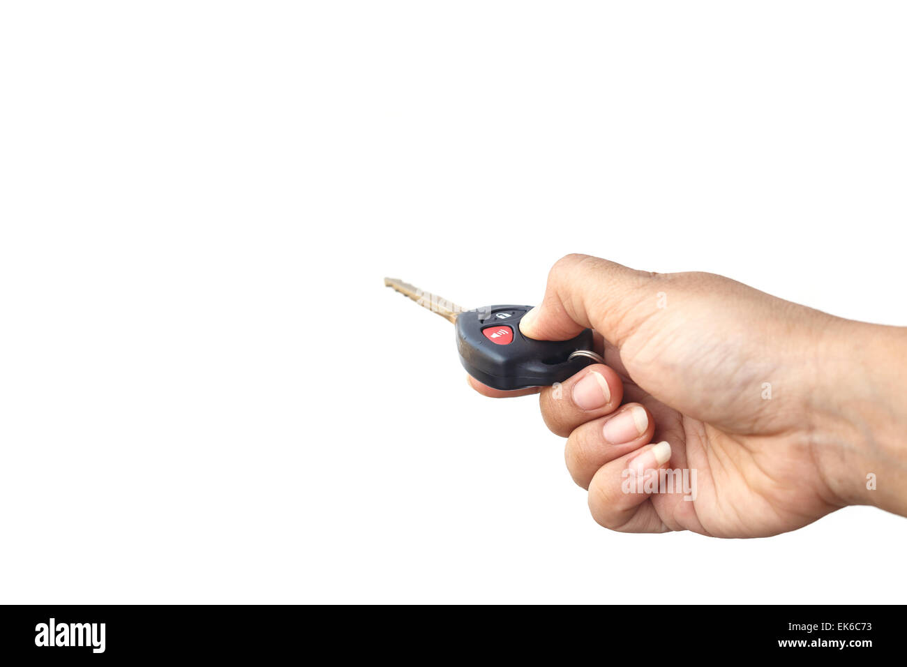 Hand holding car key isolated on white background Stock Photo - Alamy