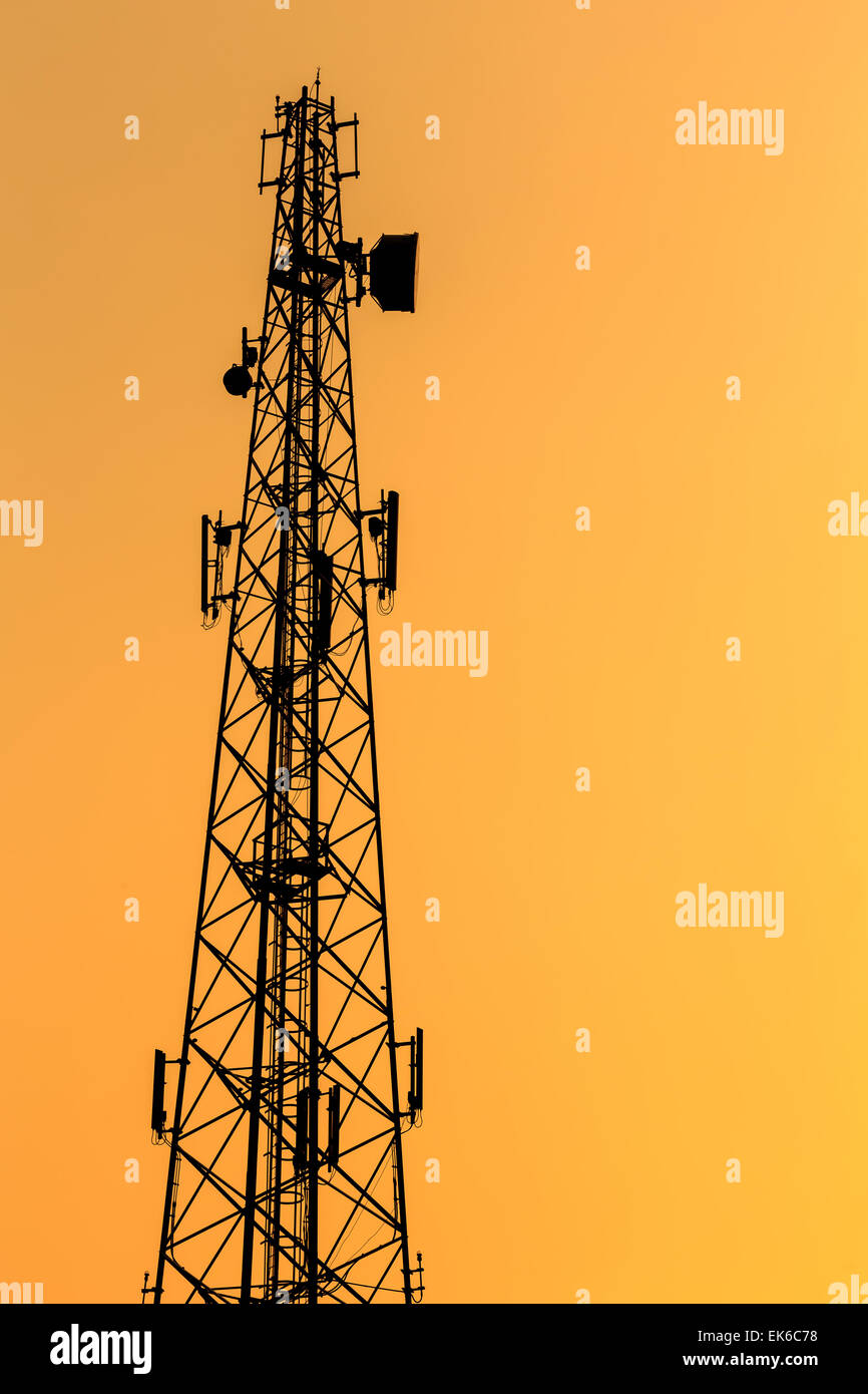 Silhouette of Communication Tower in sunset time Stock Photo