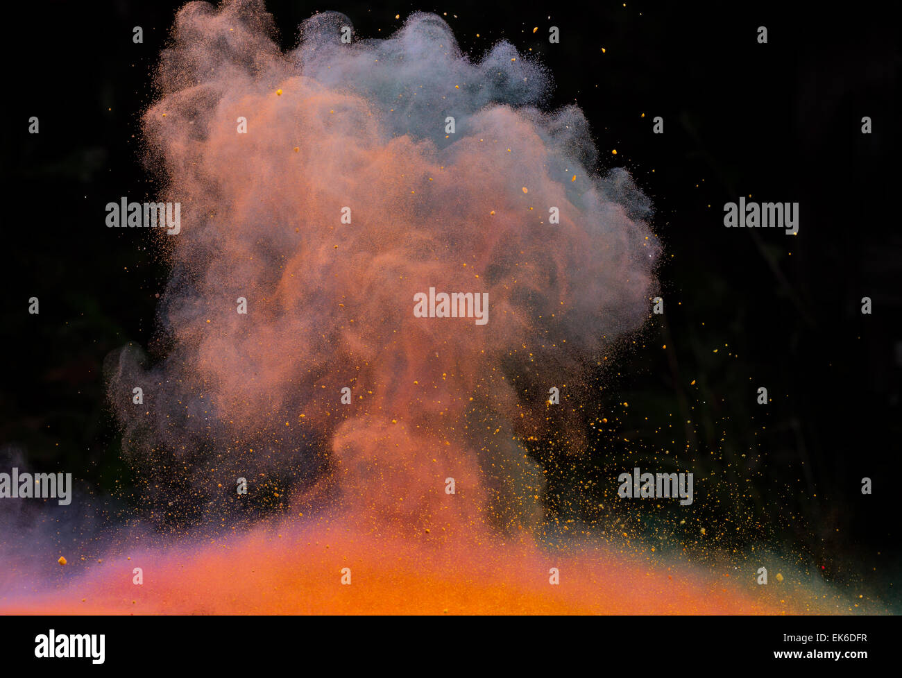 Launched colorful powder, isolated on black background Stock Photo - Alamy