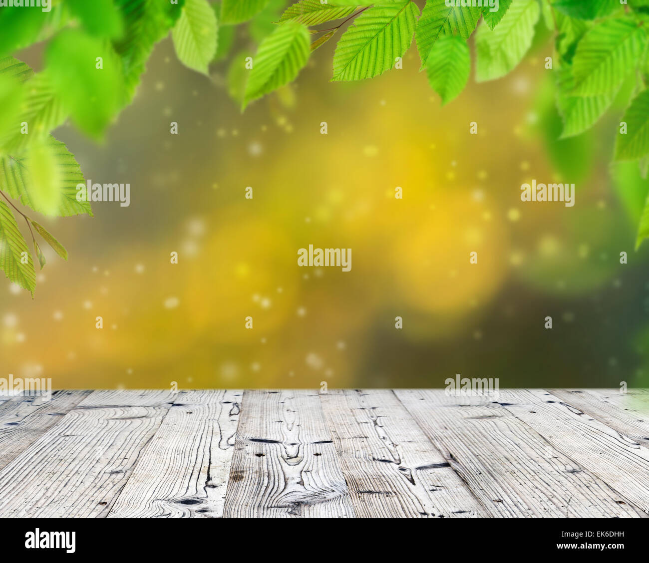Empty wooden deck table with foliage bokeh background Stock Photo - Alamy