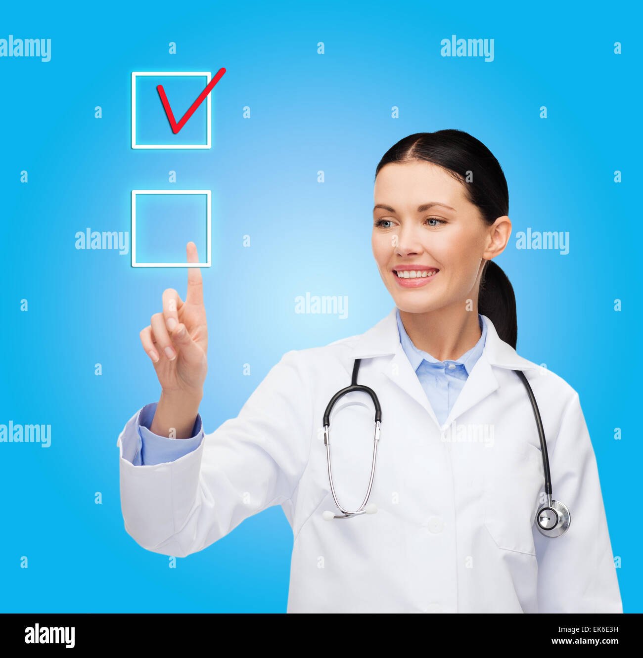smiling female doctor pointing to checkbox Stock Photo - Alamy