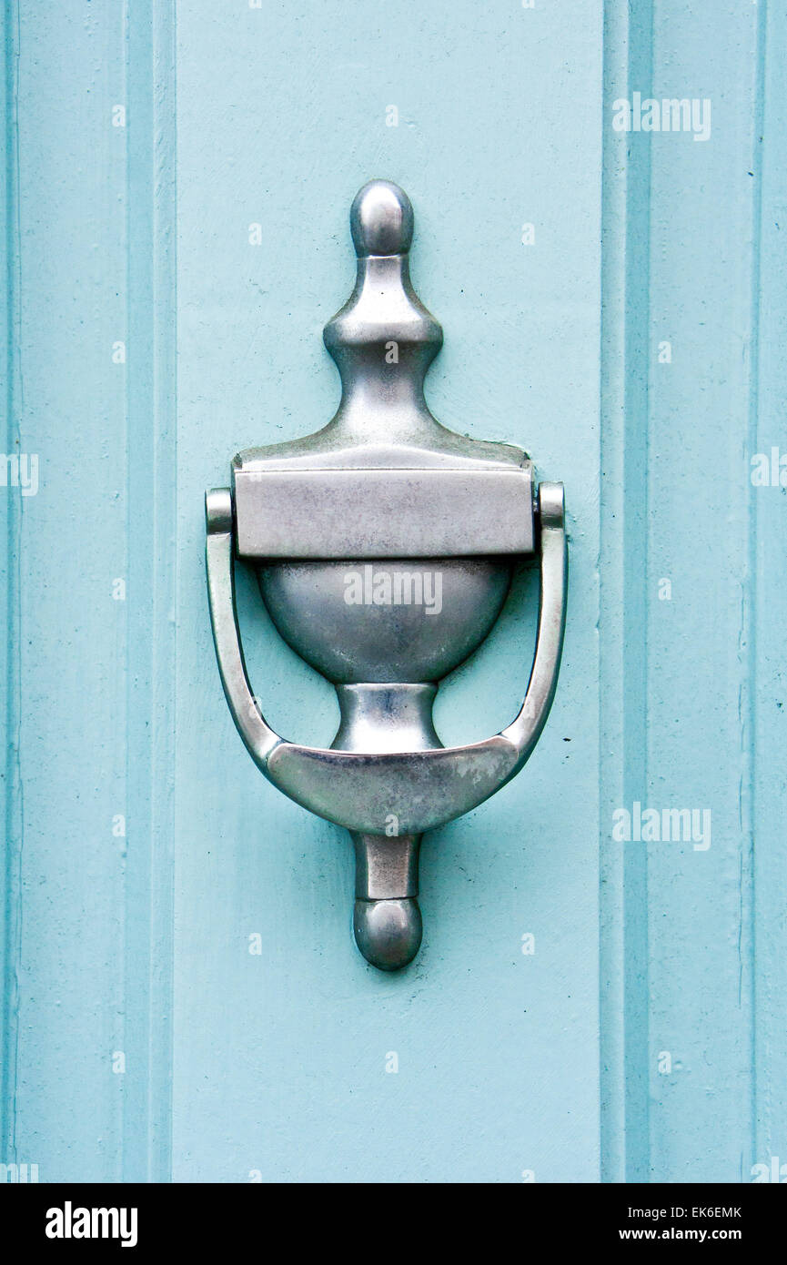 A metal knocker on a blue wooden door Stock Photo - Alamy